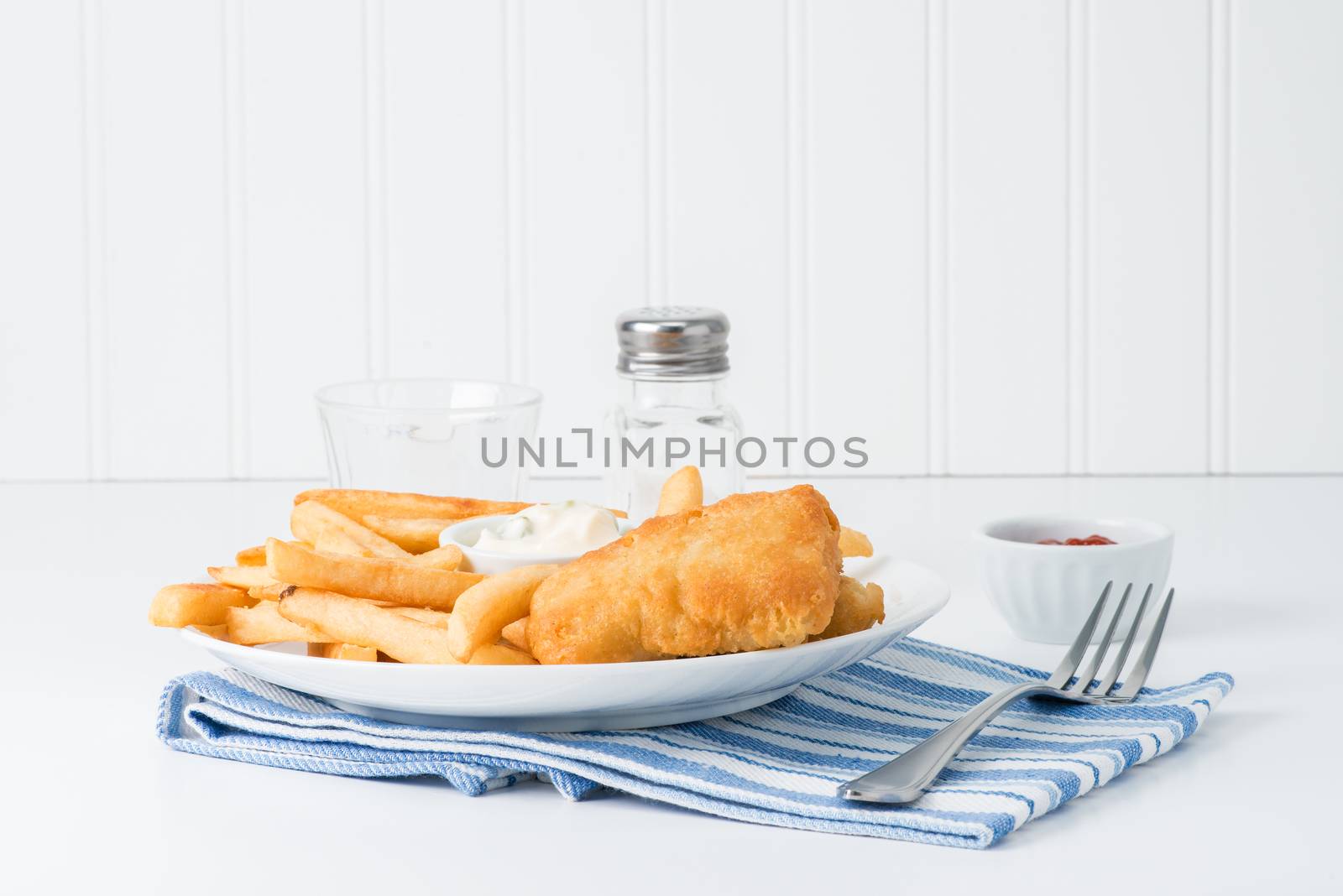 Deep fried haddock served with crispy chips.