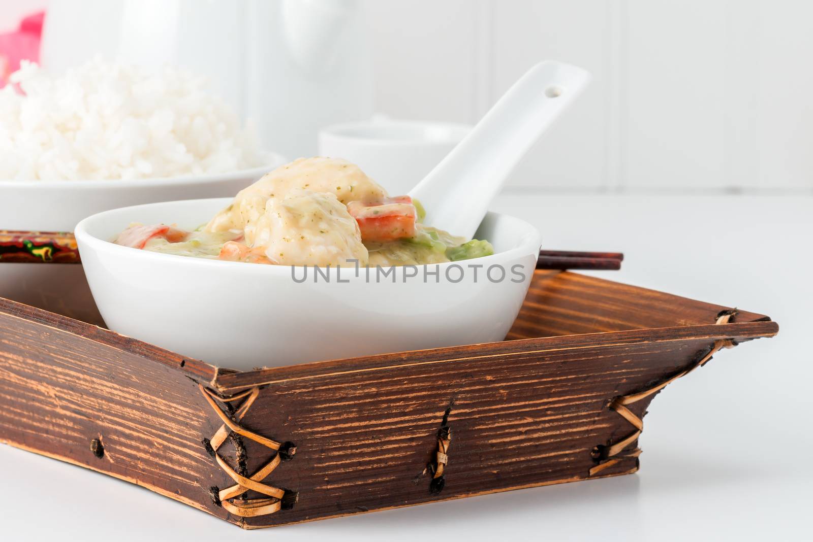 Bowl of green curry chicken photographed from closeup.