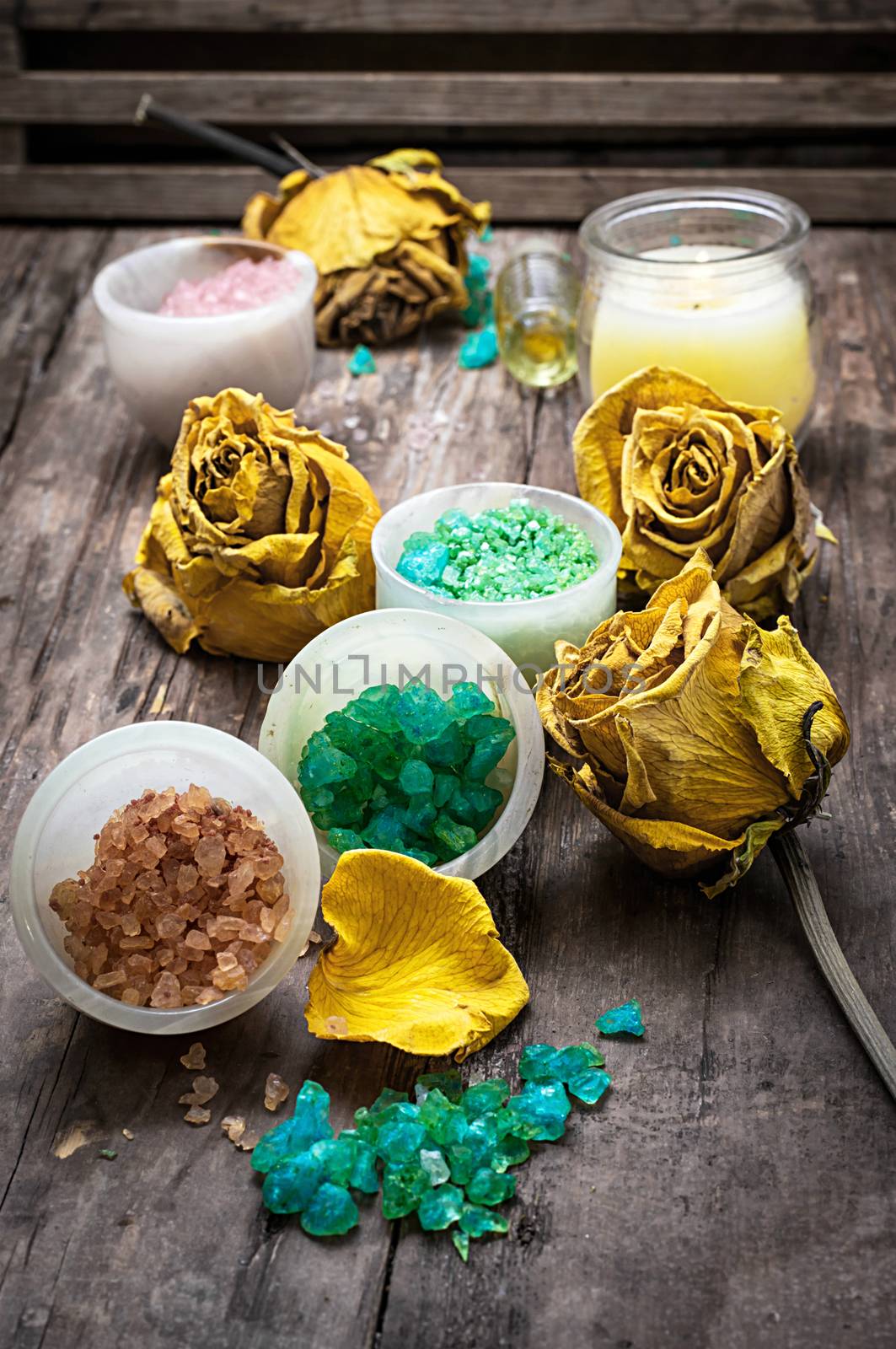 sea aromatic salt for Spa treatments on the background of yellow rose buds