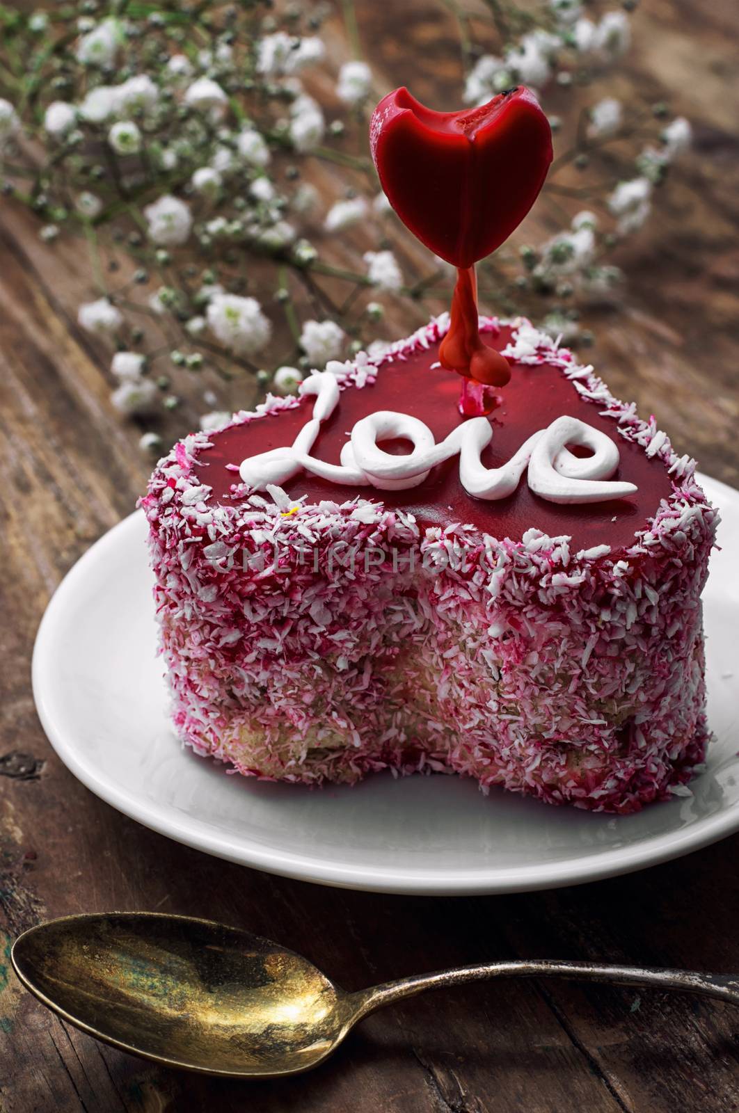 cake with fruit filling in the shape of heart with the inscription love