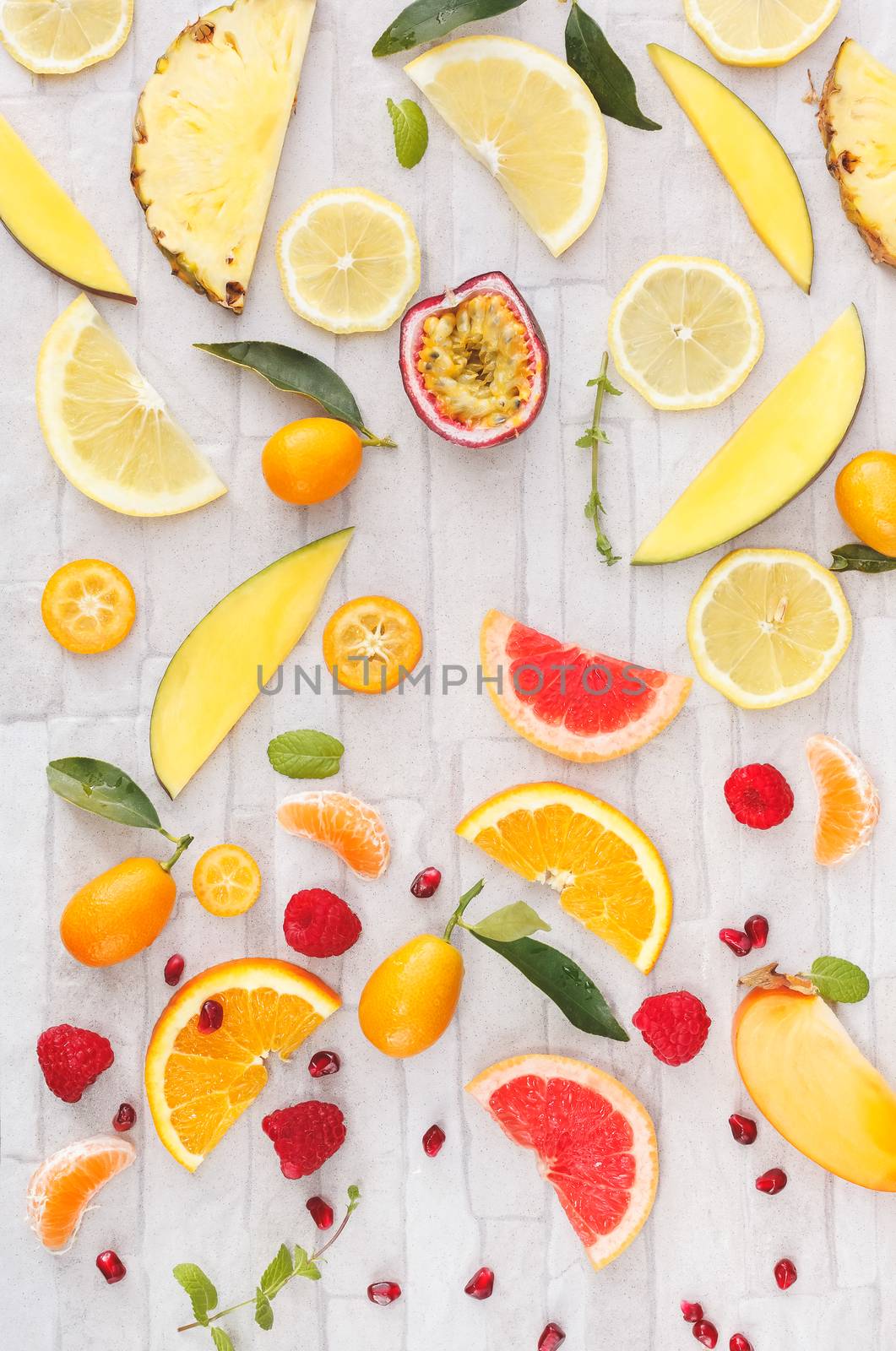 Collection of fresh whole and sliced yellow, orange and red fruits by Slast20