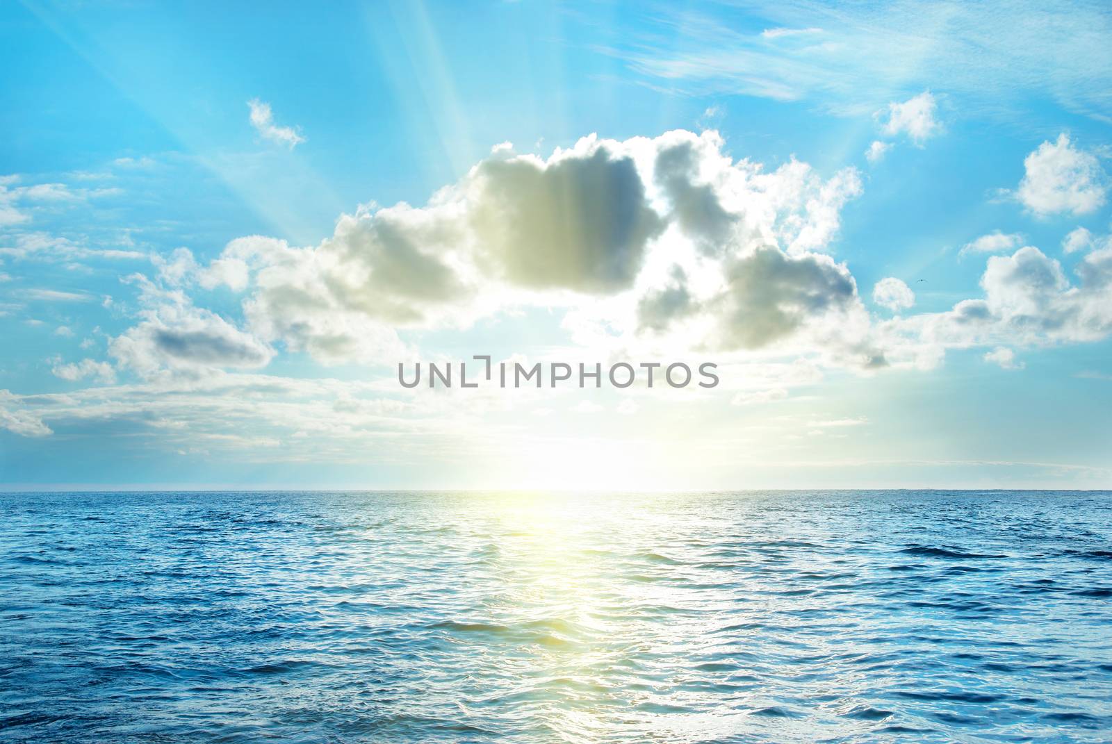 Sea with blue water, sky and clouds. Seascape