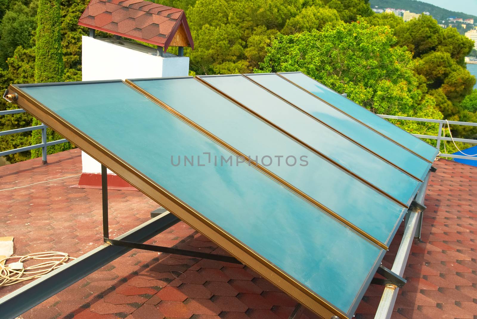 Solar water heating system on the red roof. Gelio panels.