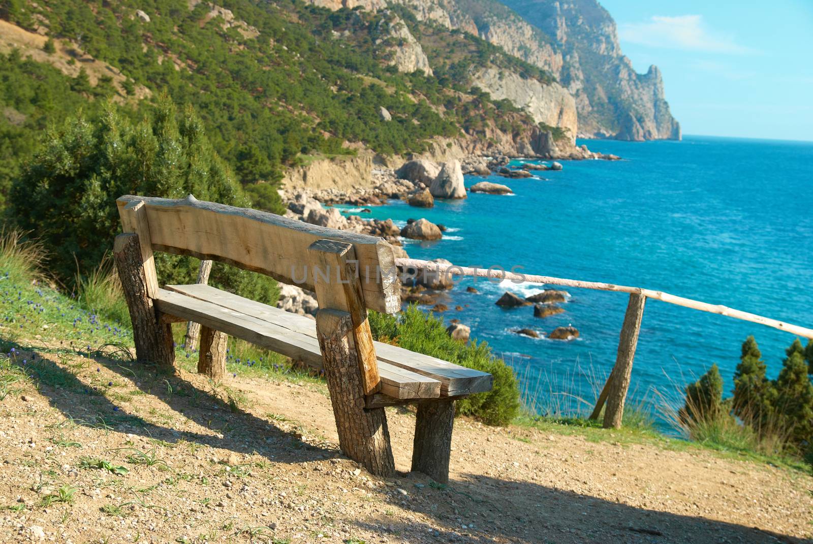 Wooden bench beautiful view on the sea. Green environment landscape