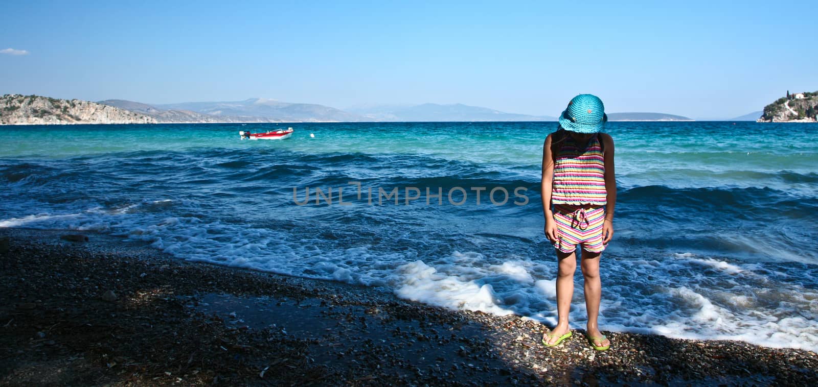 Girl at the beach in   Peloponese in Greece