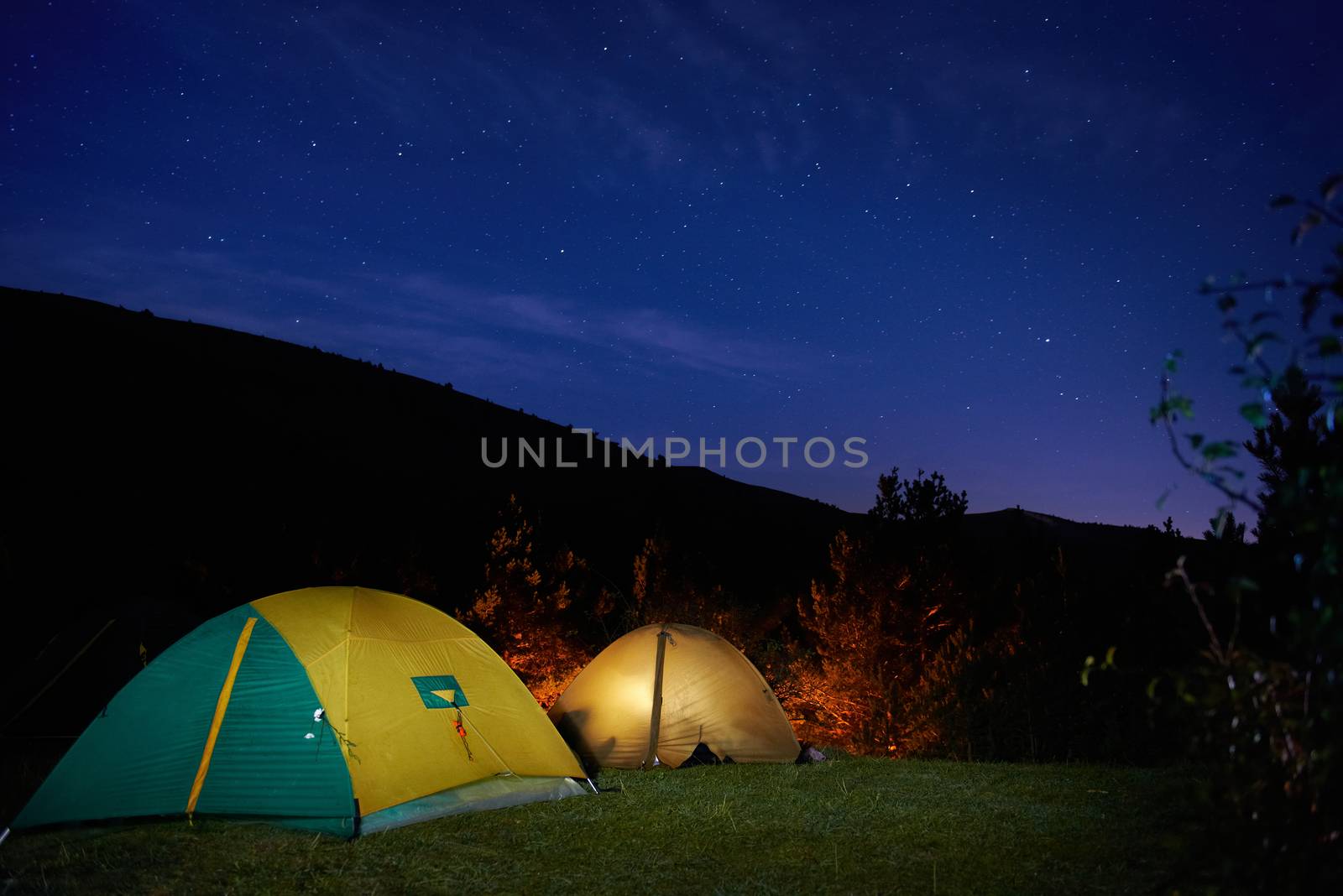 Illuminated yellow camping tent by vapi