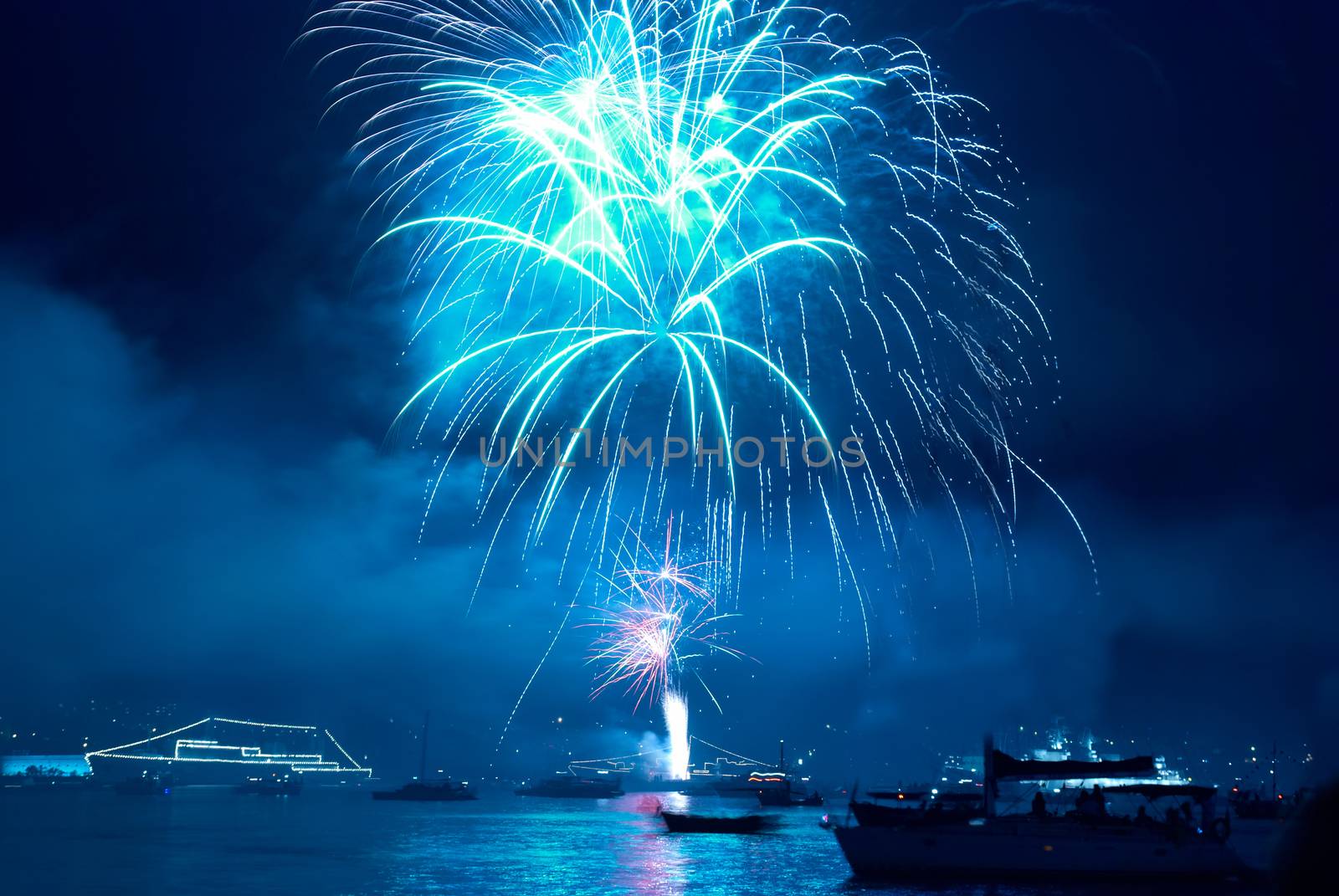 Colorful blue fireworks on the black sky background