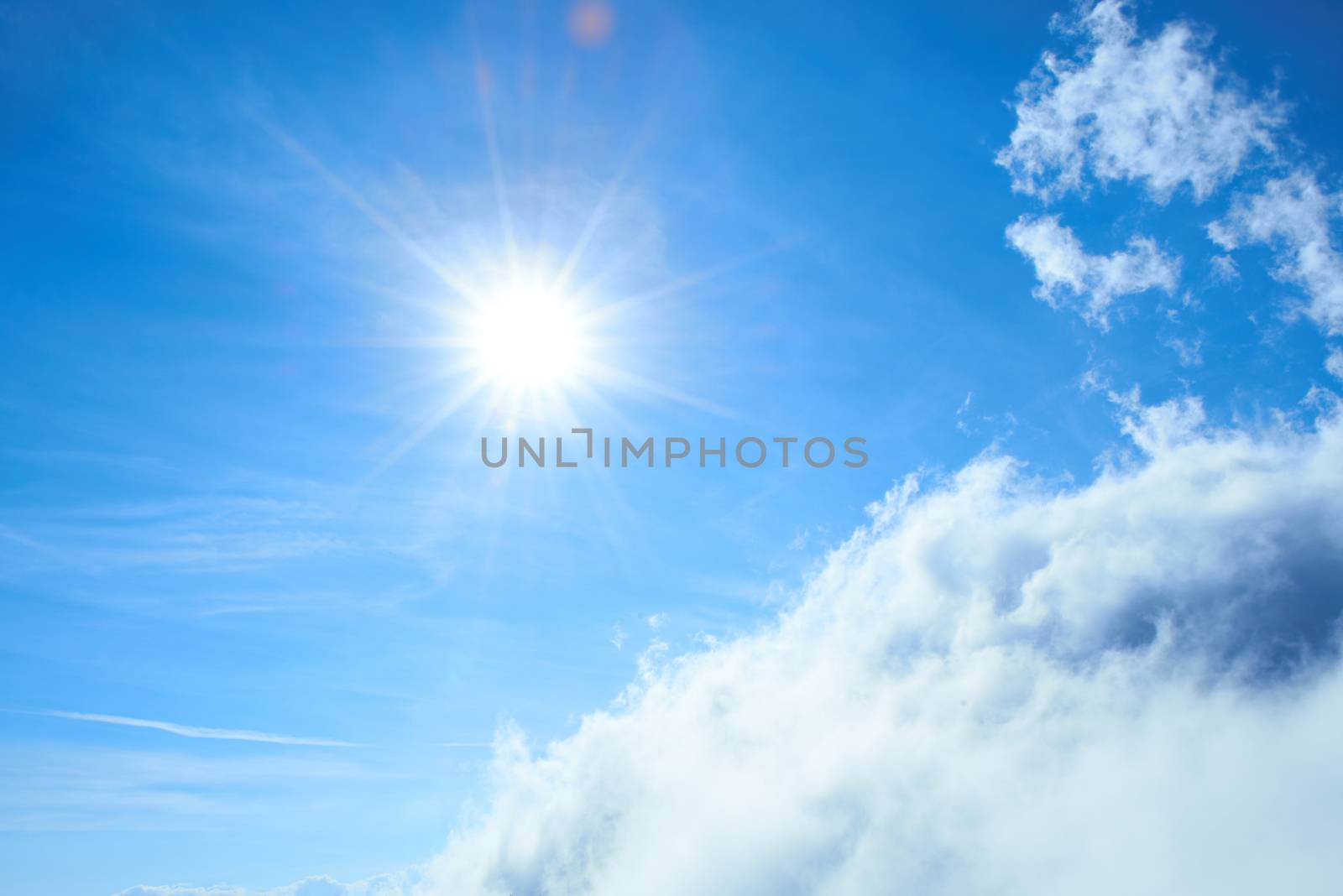 Beautiful blue sky with sun and clouds