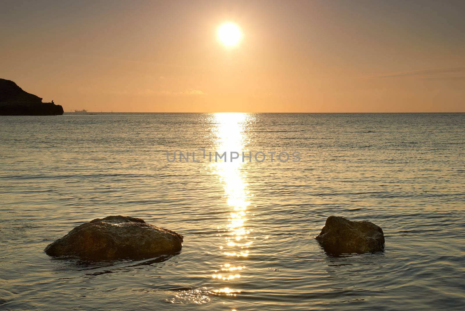 Sea shore and stones. Seascape at sunset.