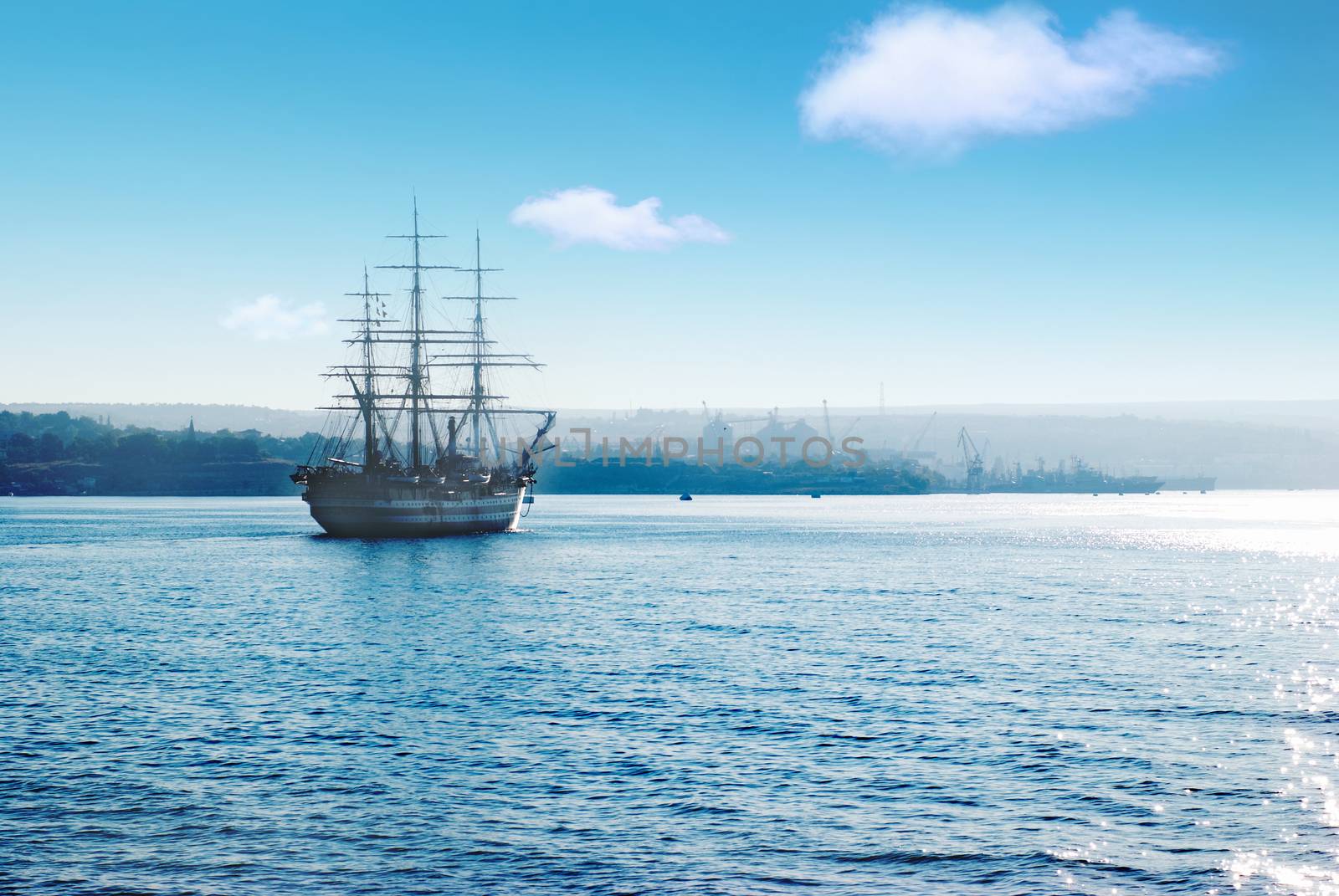 Beautiful sailing vessel in the sea comes into bay