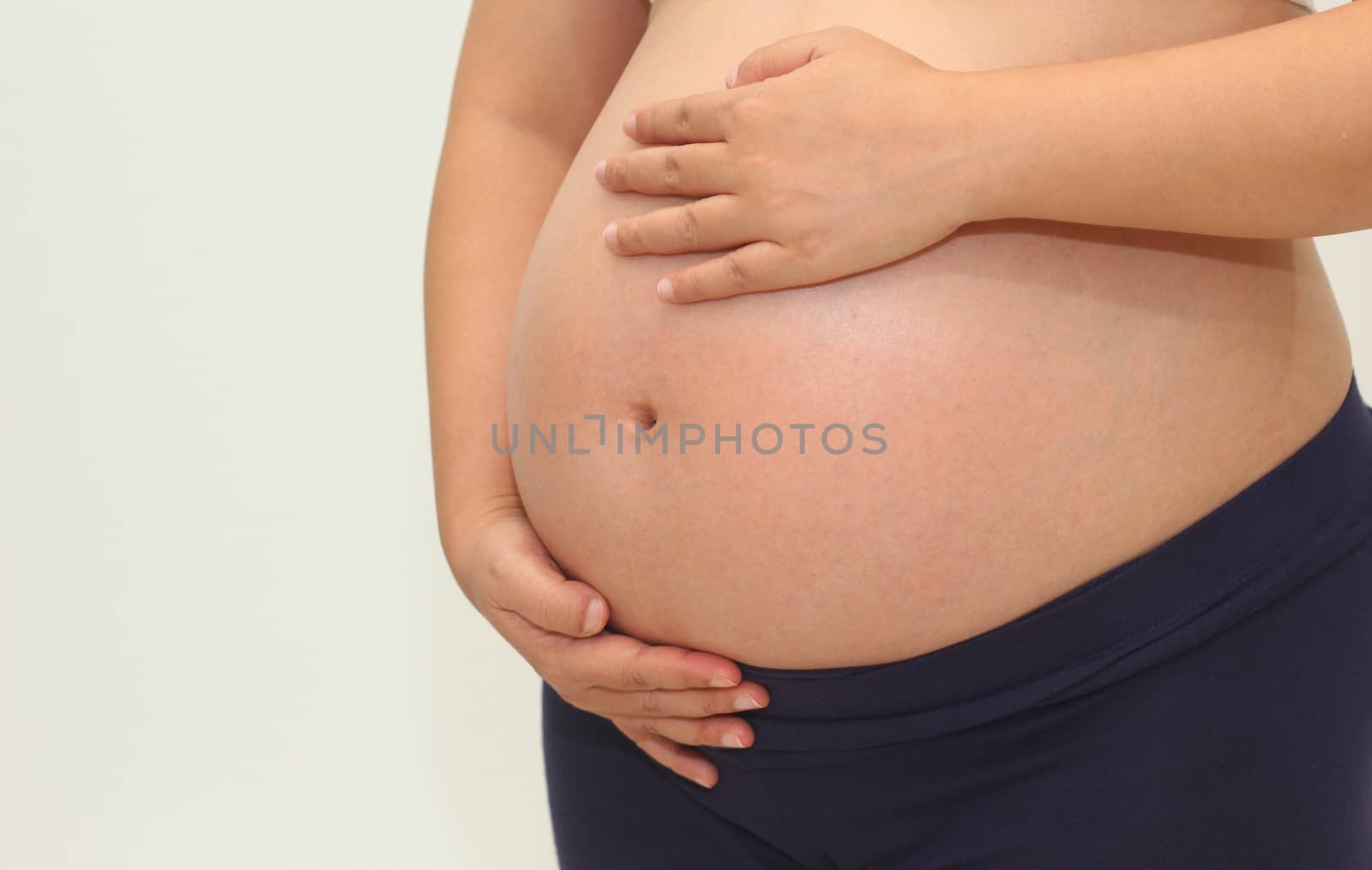 Photo of a cute pregnant woman belly