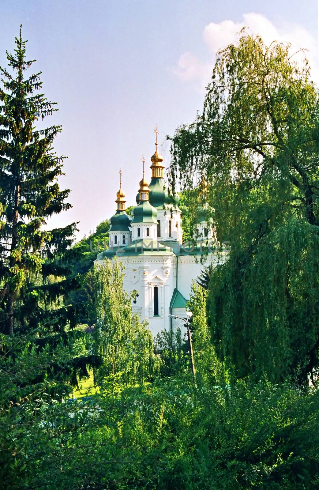 Church and the green trees.