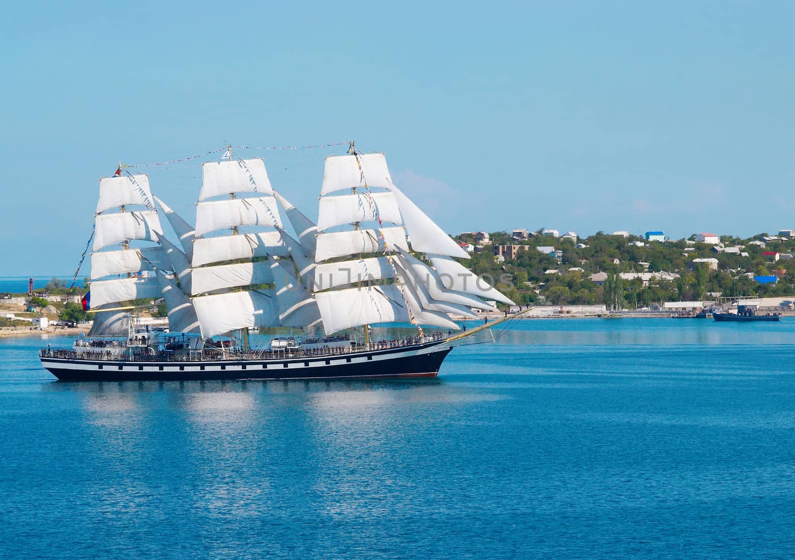 Sailing ship entering to the bay.