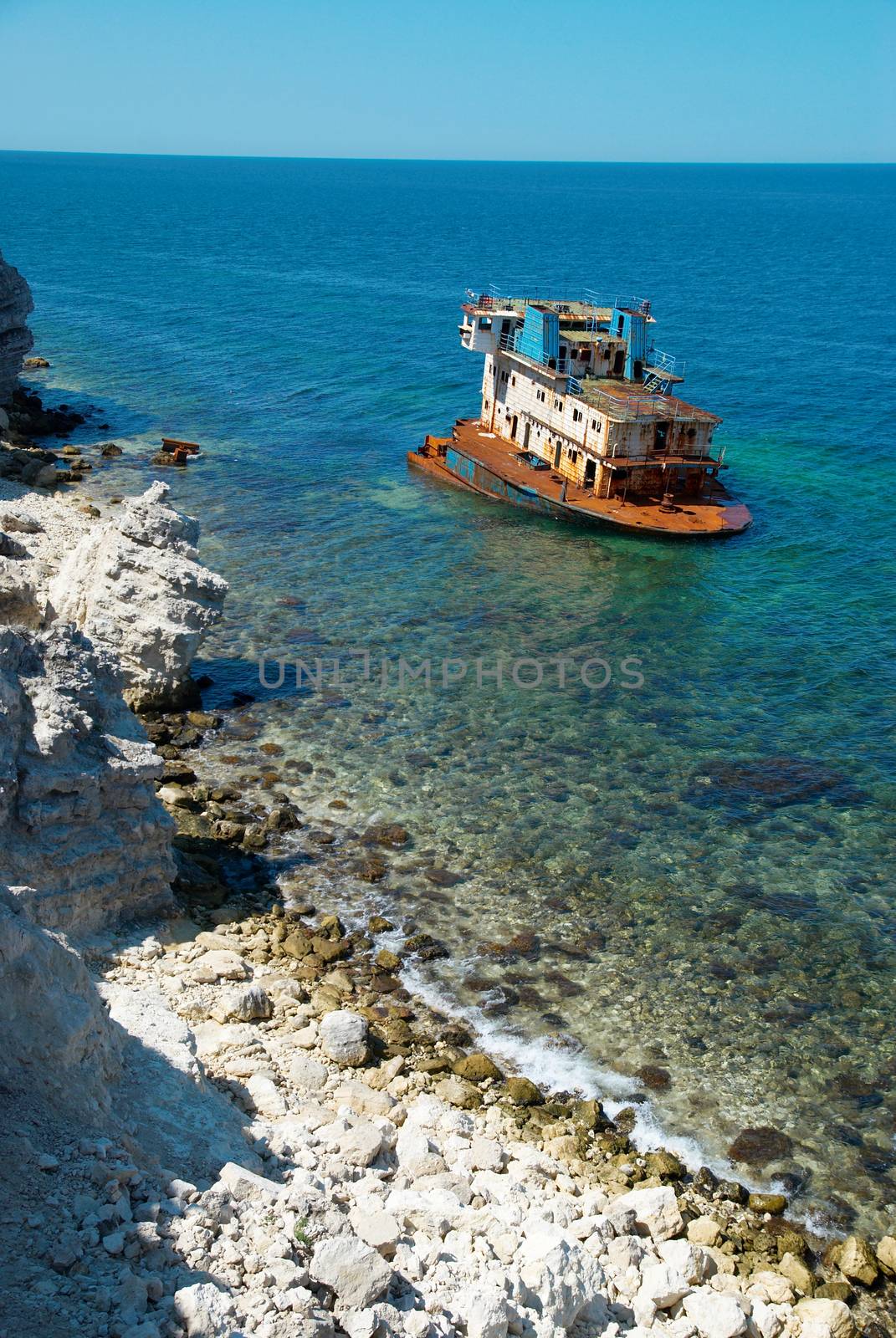 Wreck ship near the coast. by vapi