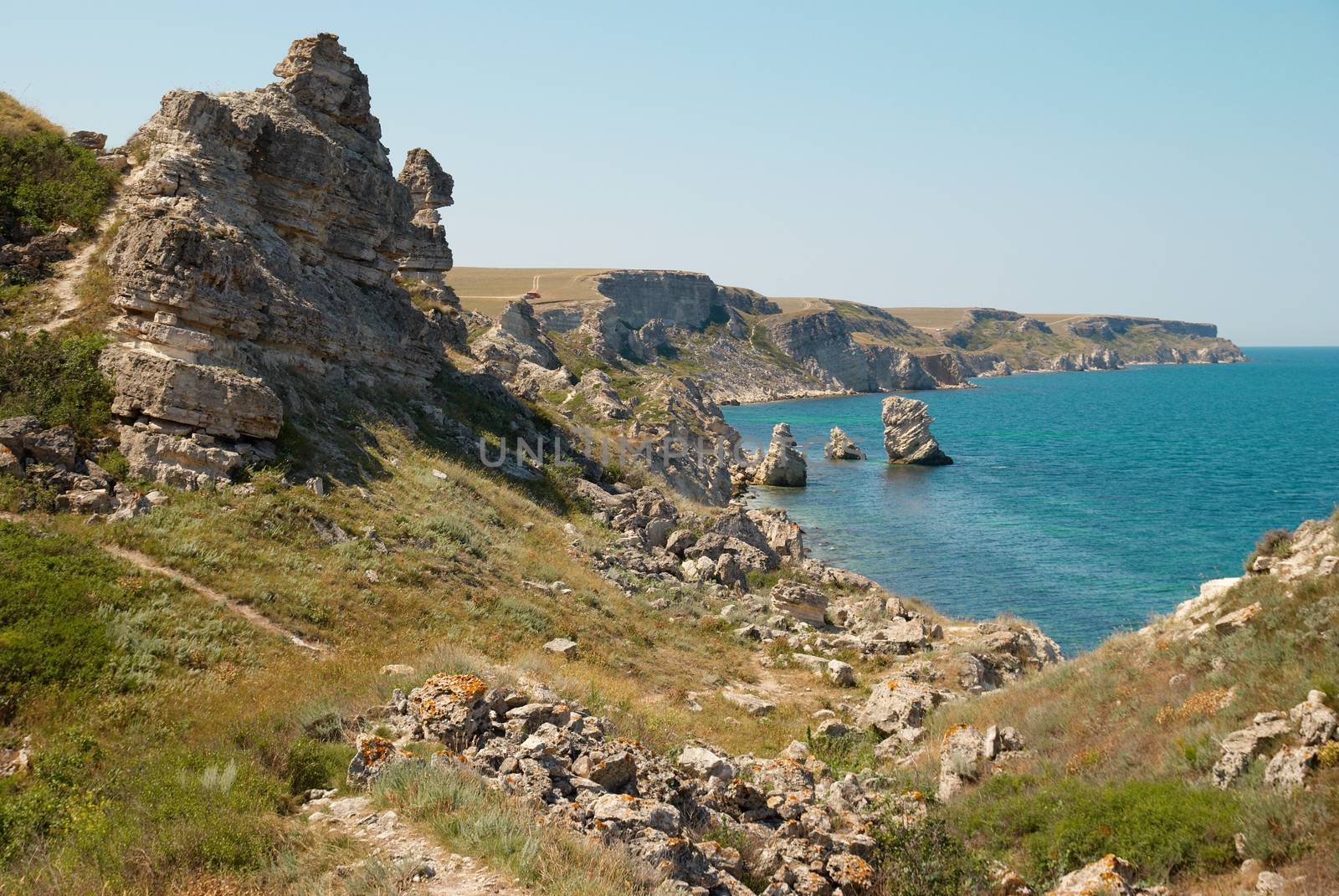 A coastline with many big rocks.