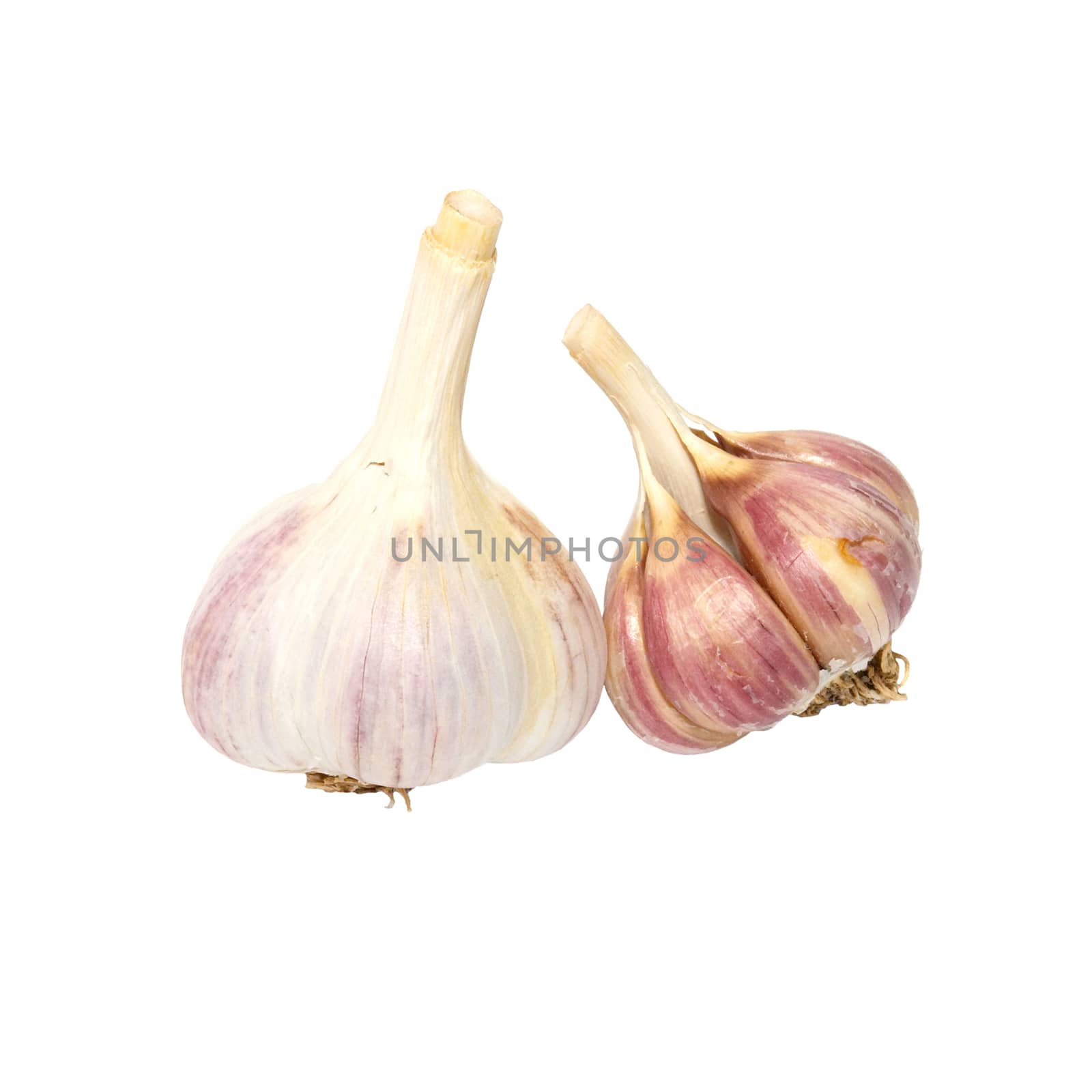 Two garlic cloves isolated on white. by vapi