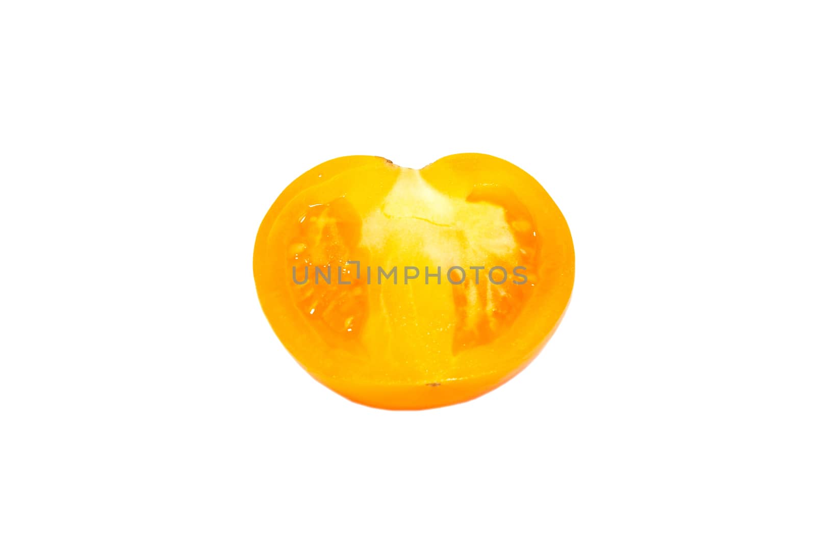 A half of fresh yellow tomato isolated on white. by vapi