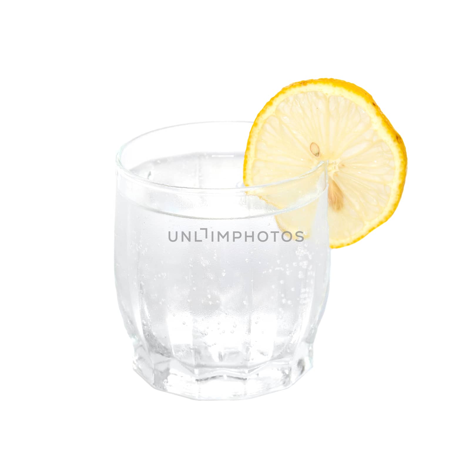 A cold water glass with lemon isolated on white. by vapi