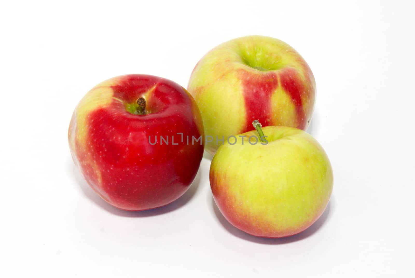 Three fresh apples isolated on white. by vapi