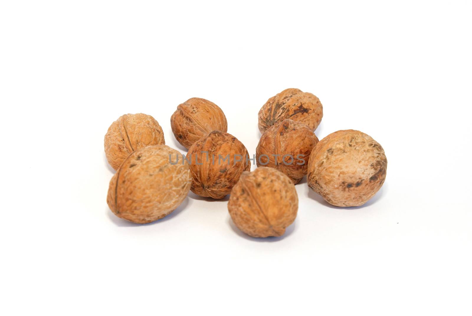 A group of walnuts isolated on white. by vapi