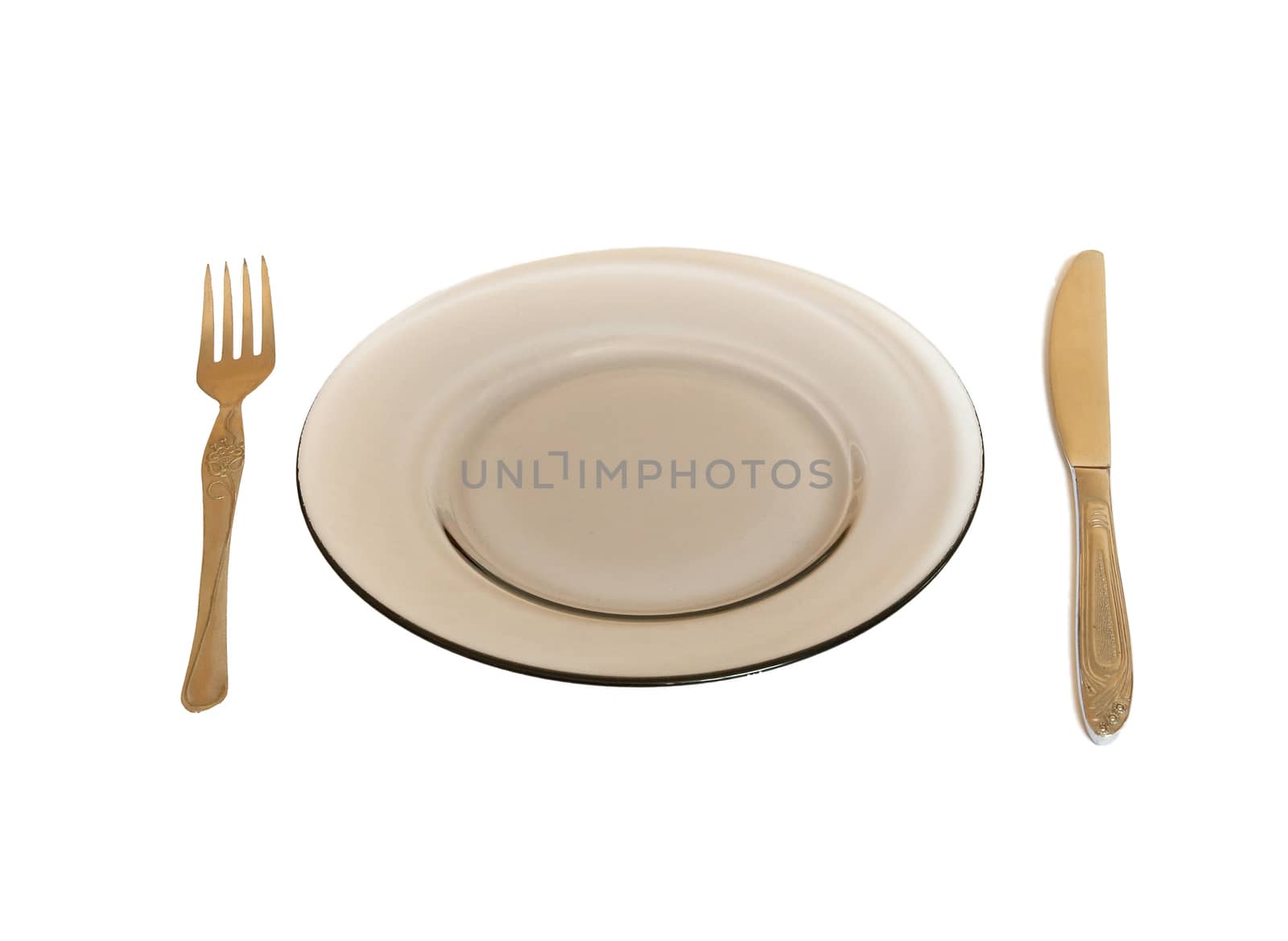 Dinner Plate, Knife, and Fork isolated on white.