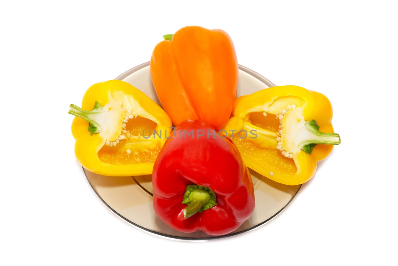 Three colored paprika on the plate on white background. by vapi