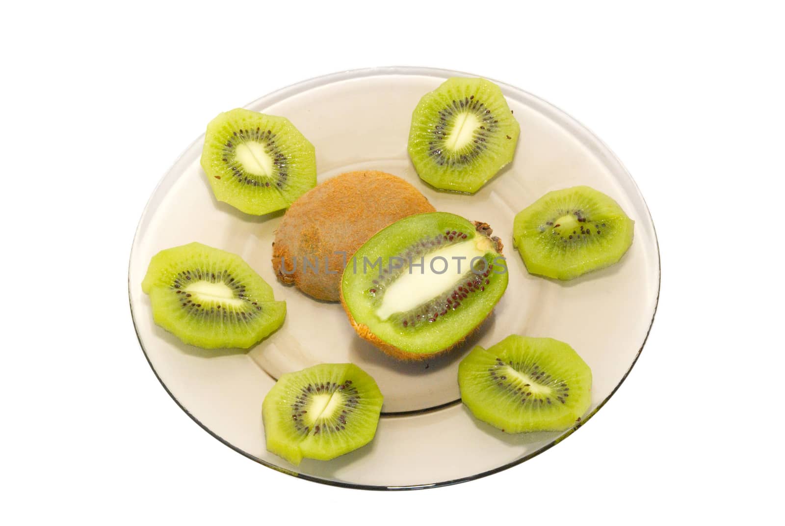 Fresh kiwi on the plate isolated on white. by vapi