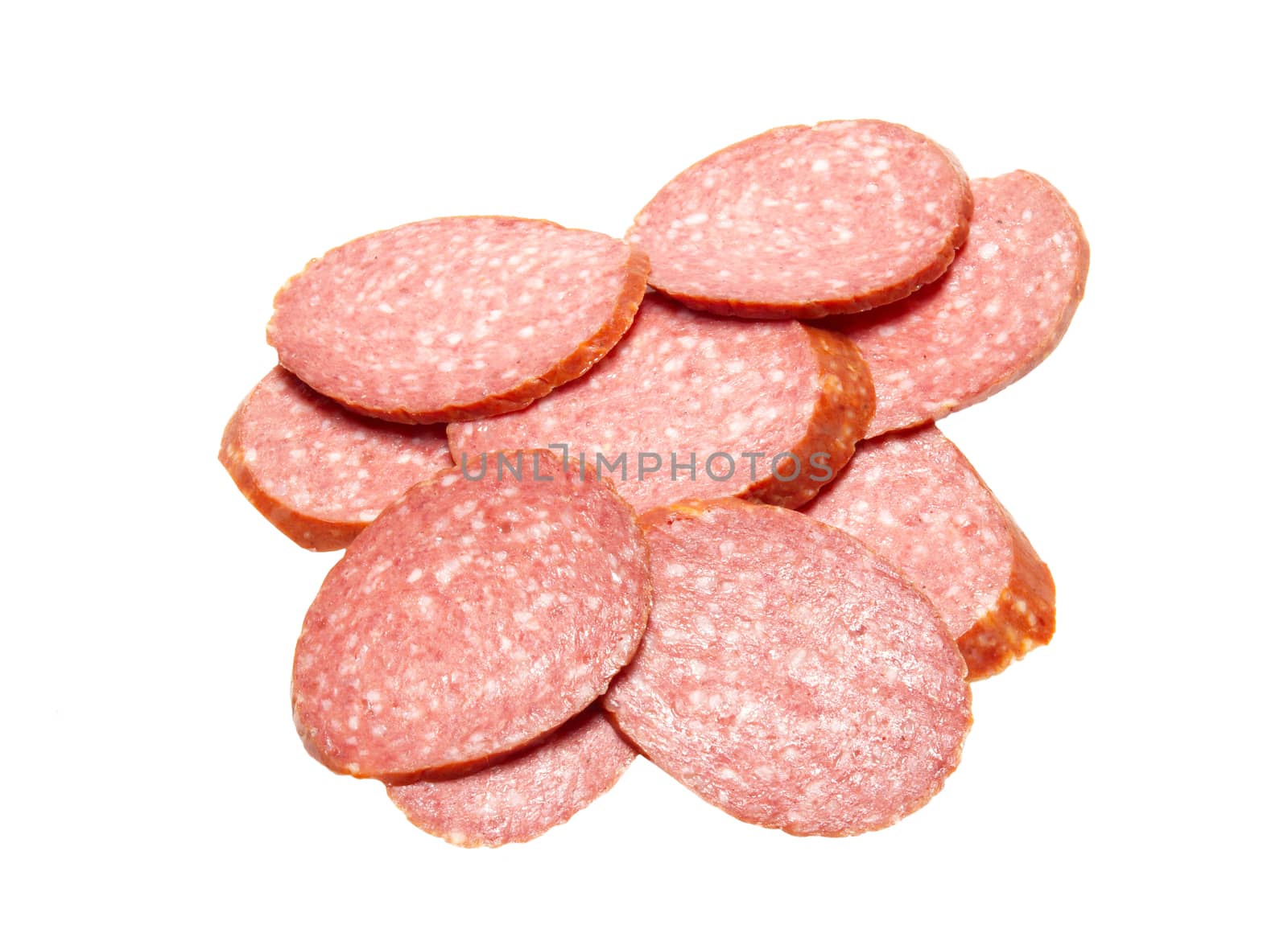 Bits of summer sausage isolated on white. by vapi