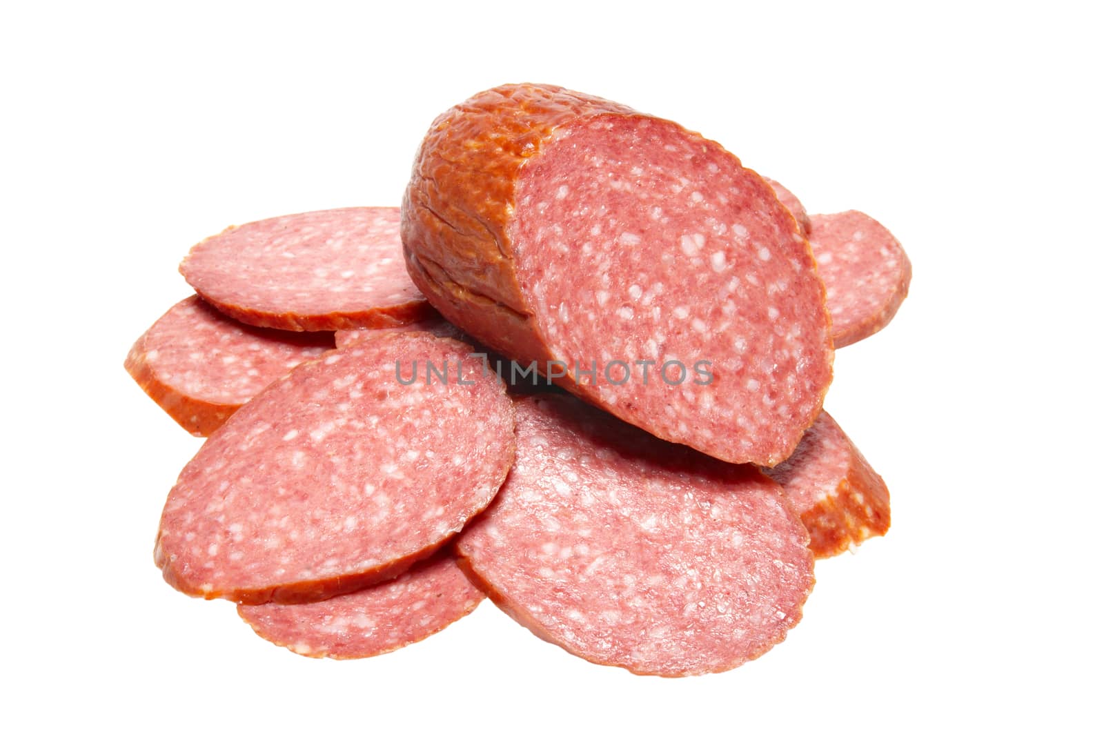 Bits of summer sausage isolated on white. by vapi