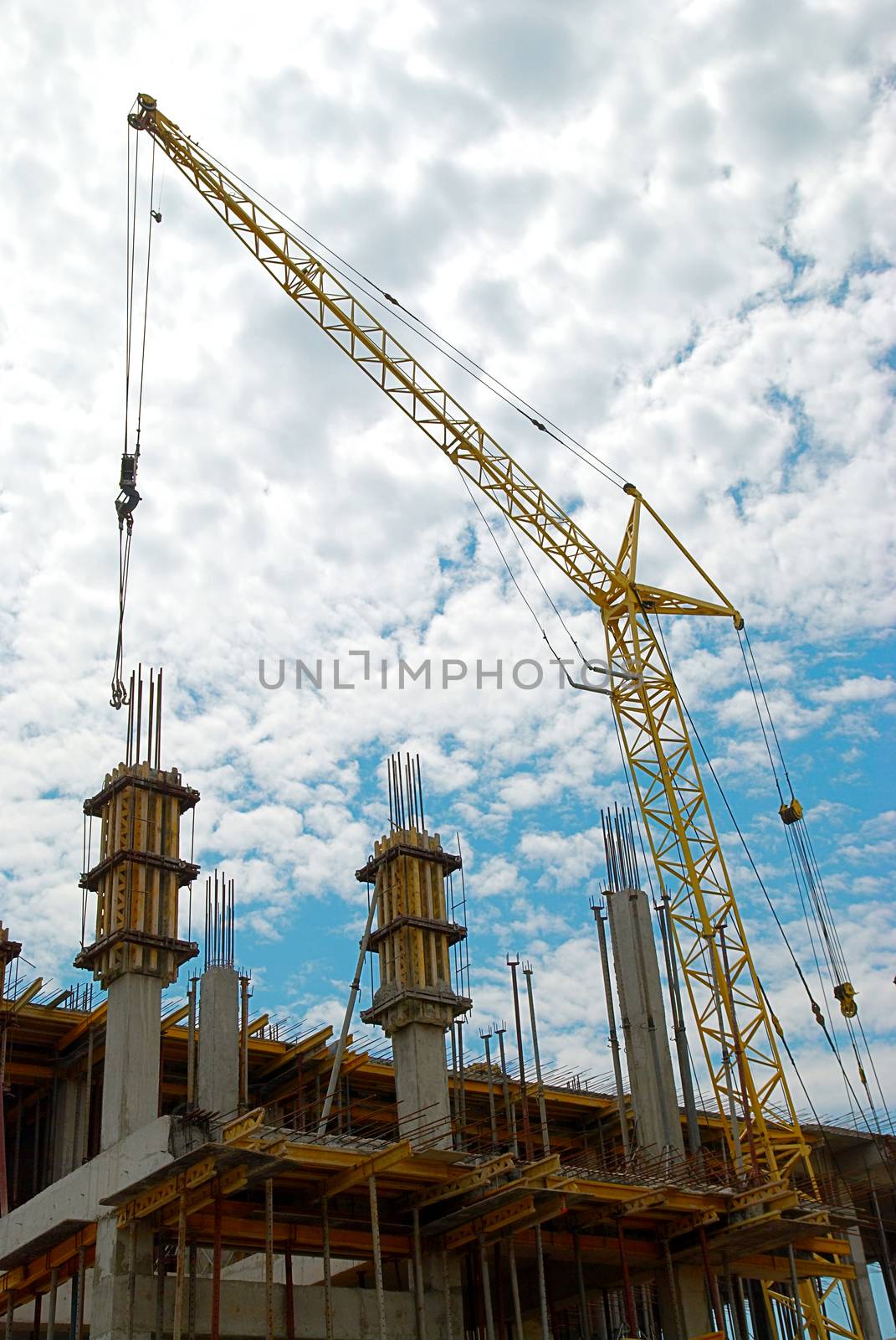 Building crane and the building under construction.