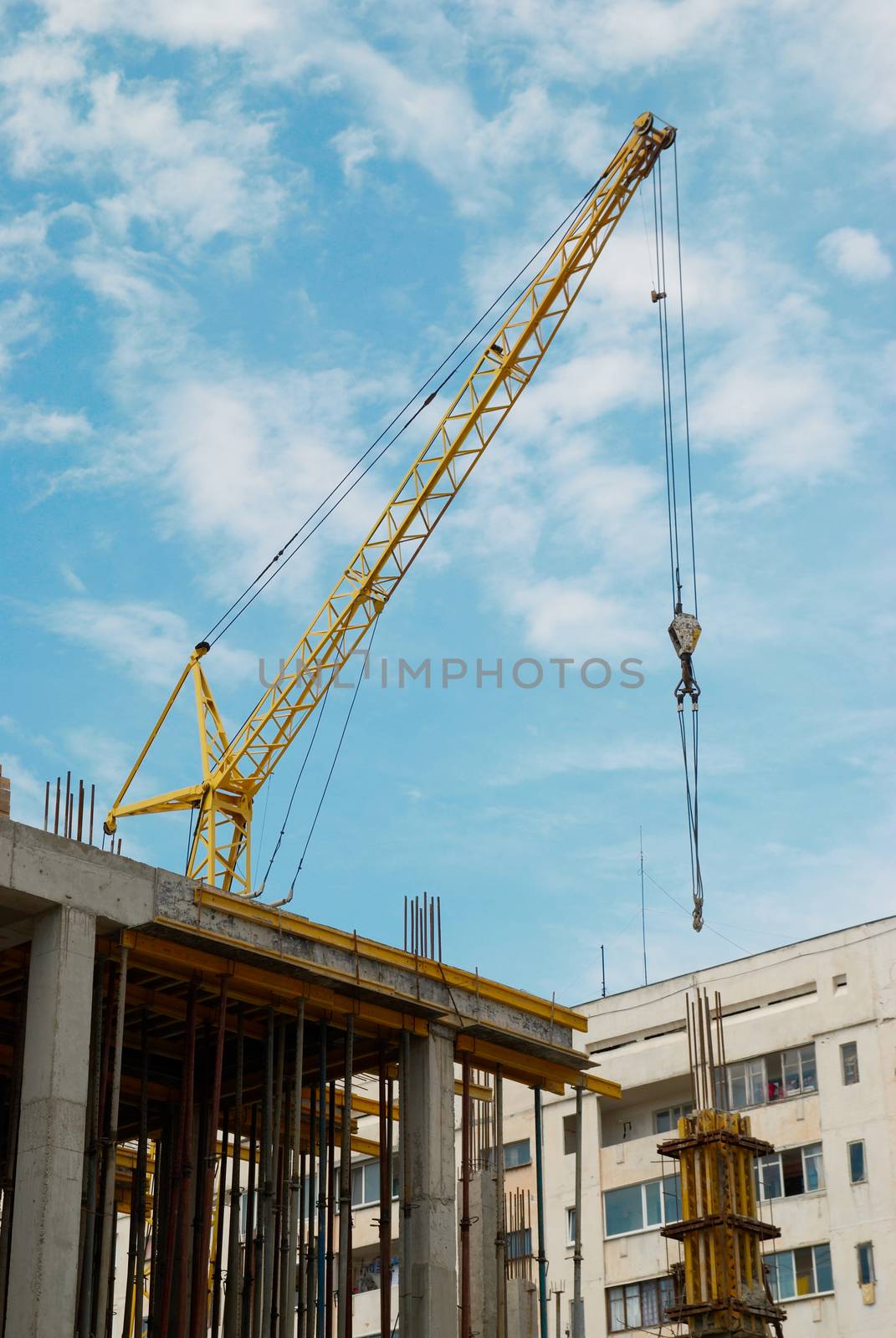 Building crane and the building under construction.