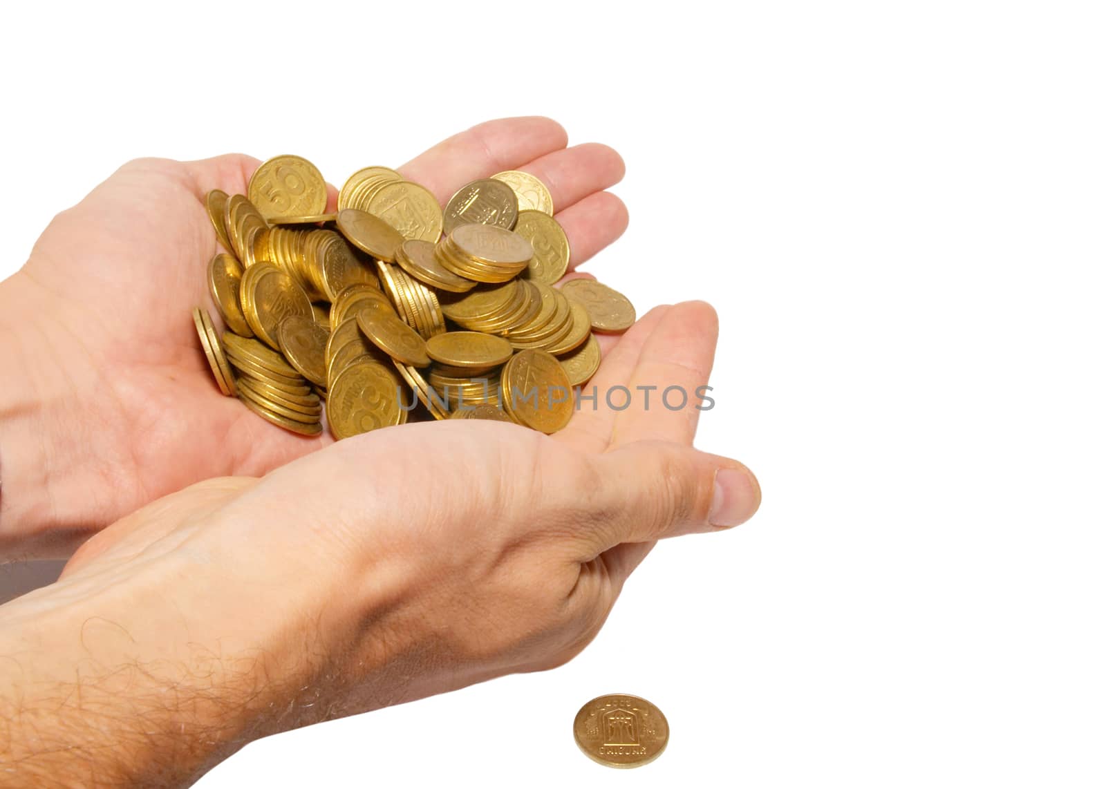 Many coins in cupped hands isolated on white.