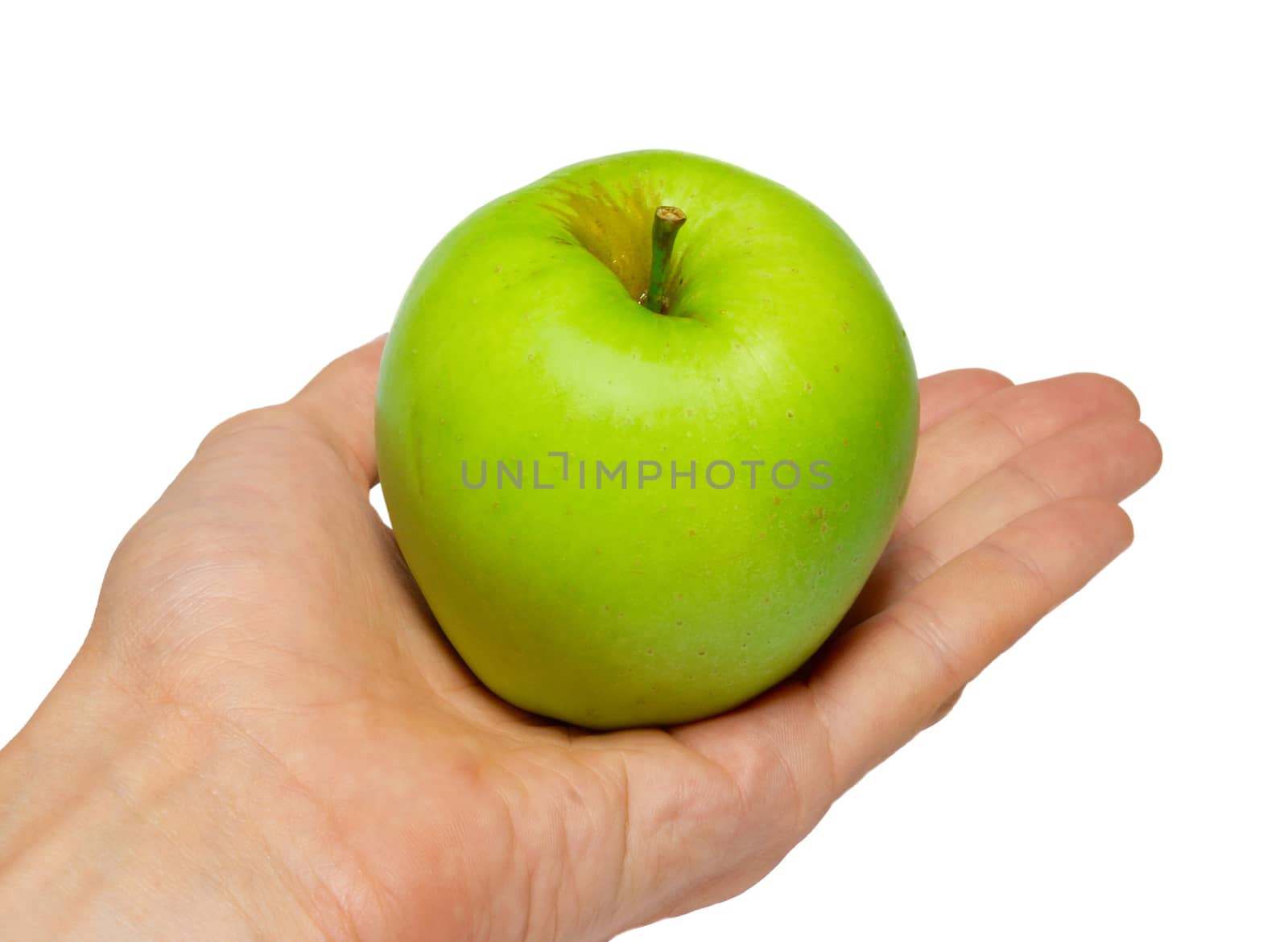 Green tasty apple in a hand isolated on white.