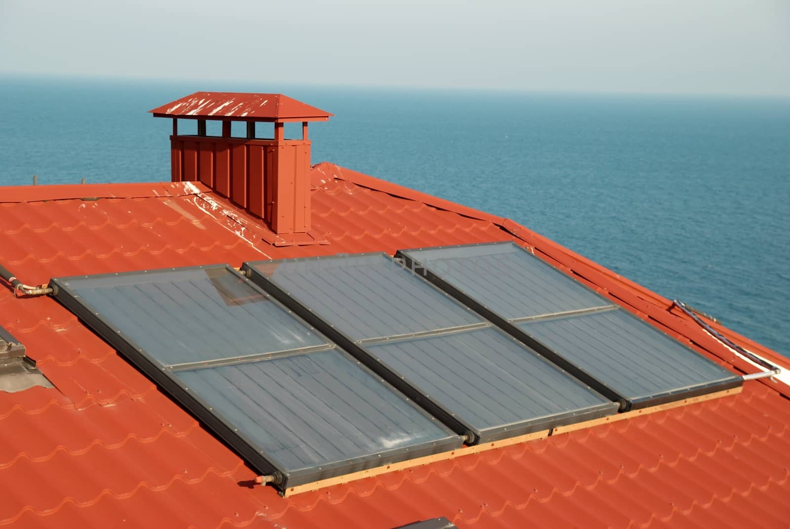 Alternative energy- solar system on the house roof.