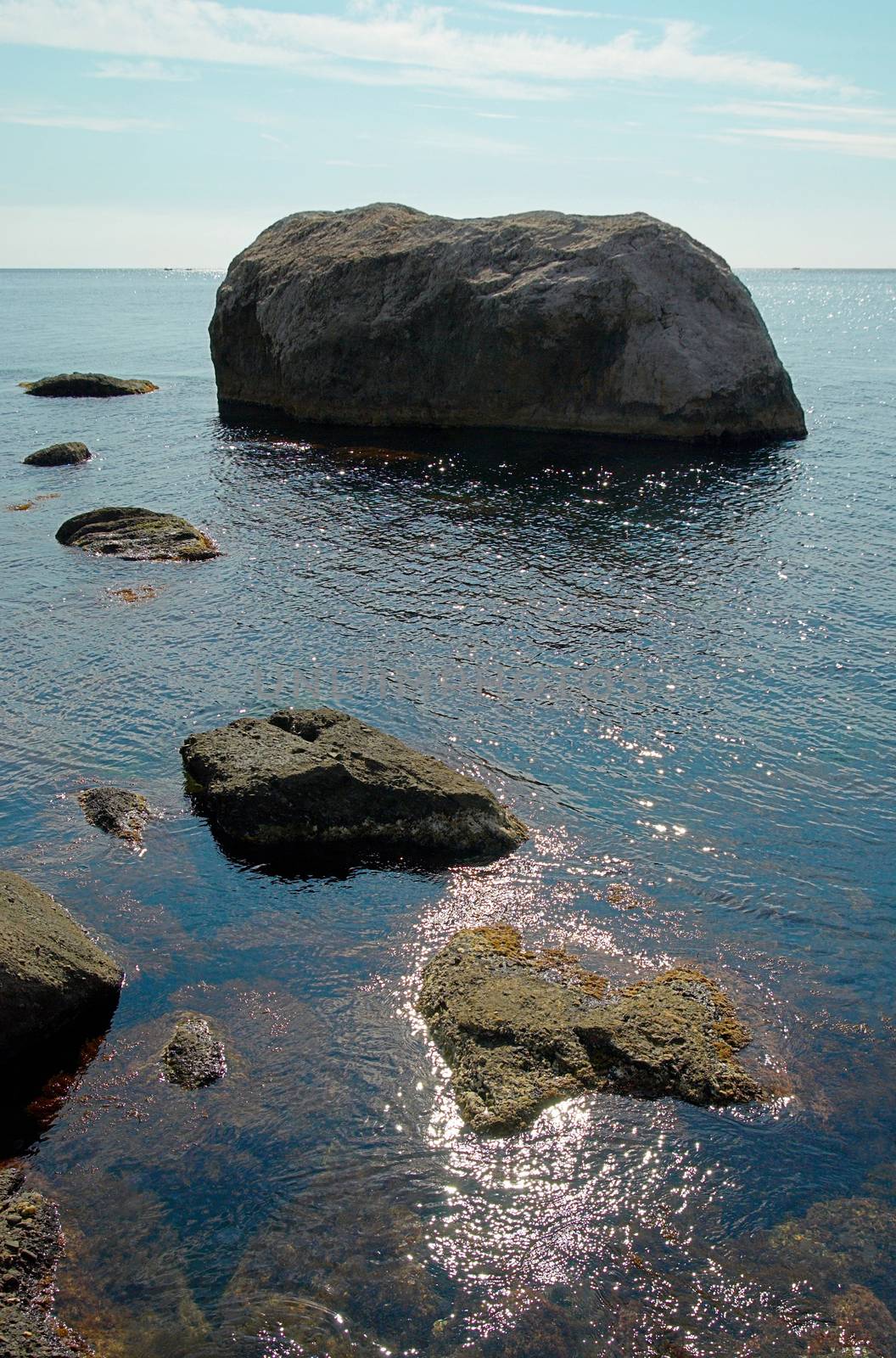 Sea landscape with rocks and water surface. by vapi