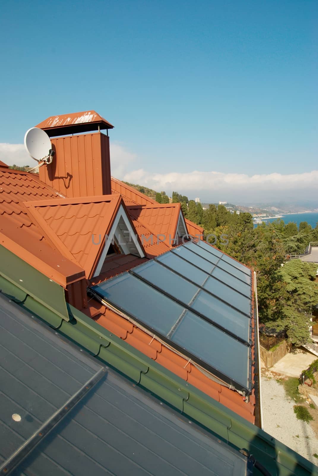 Alternative energy- solar system on the house roof. by vapi