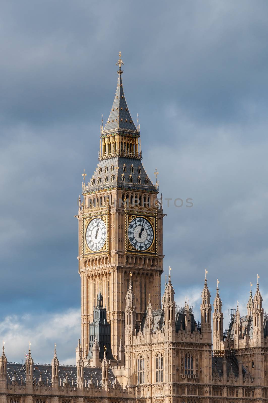 Big Ben Clock Tower in London against cloudy sky