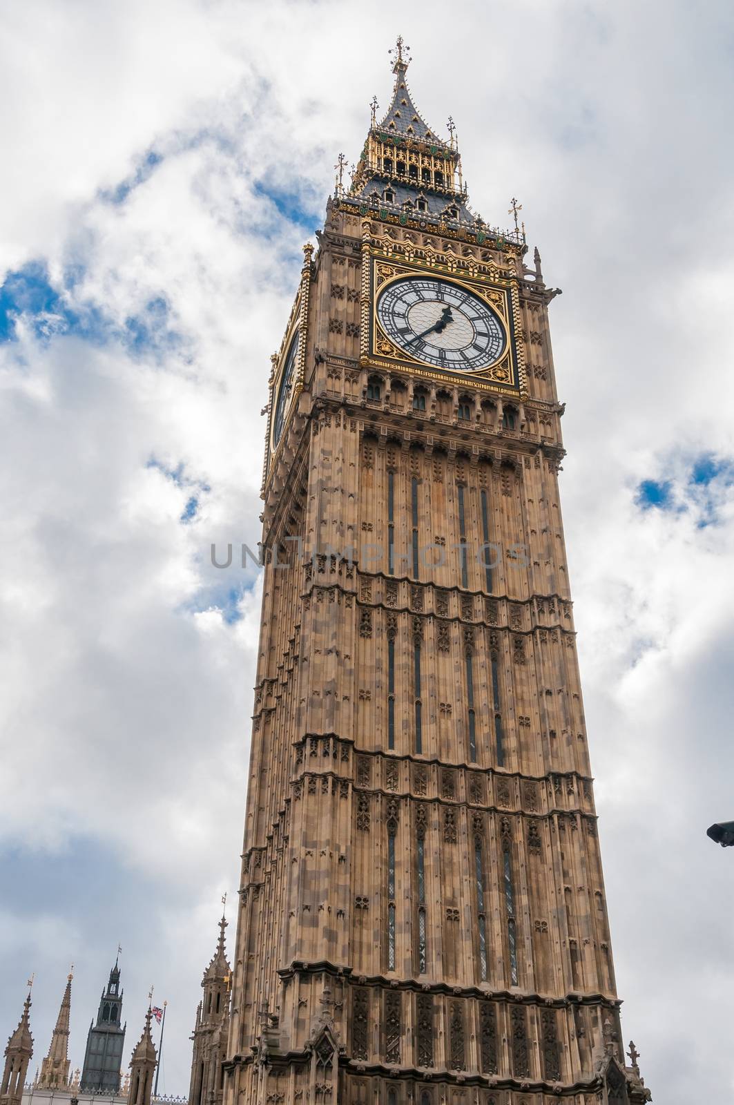 Closeup of Big Ben Clock Tower in London against cloudy sky