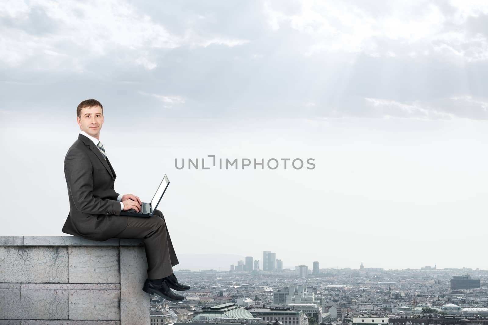 Businessman working on laptop by cherezoff