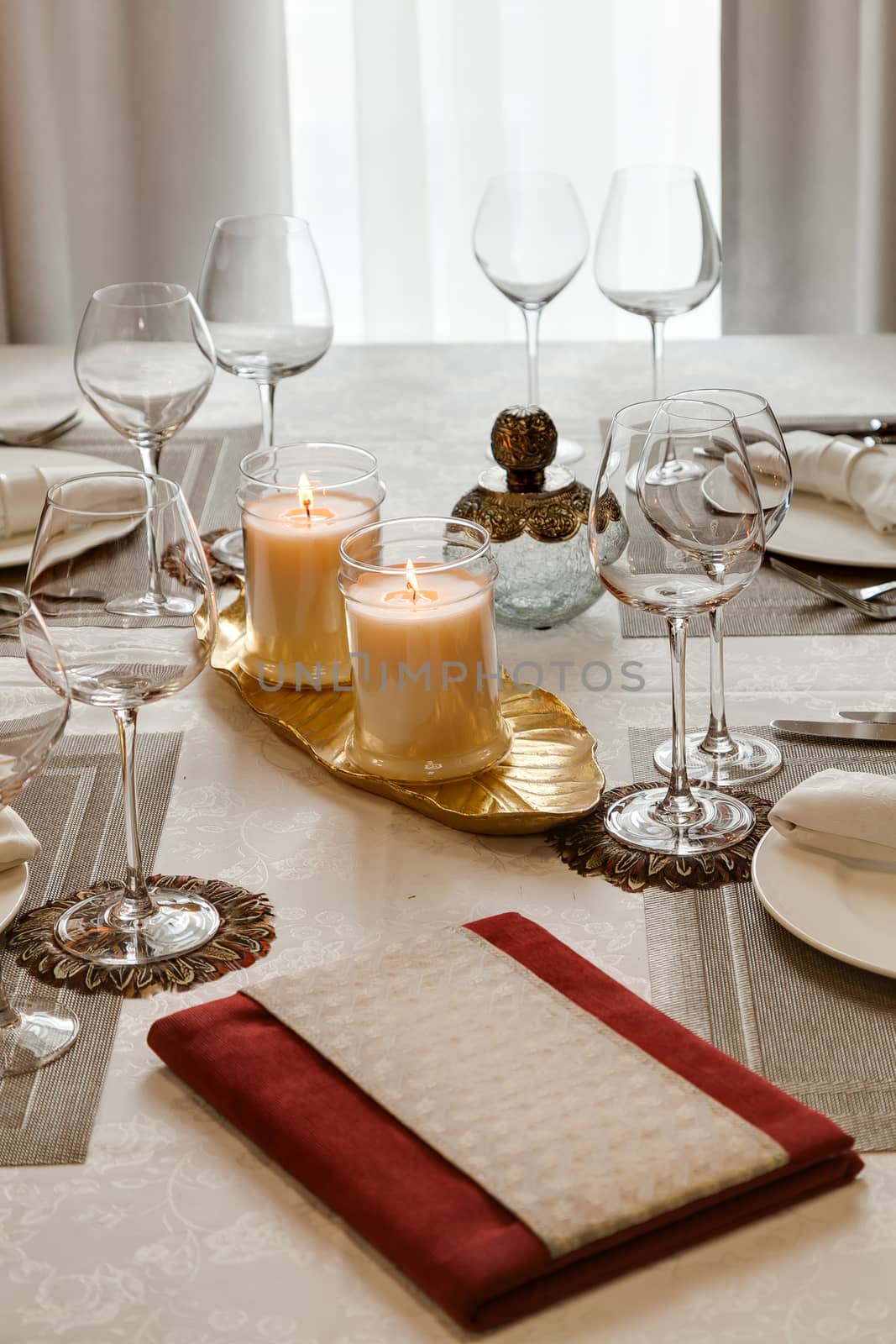 the laid table with candles at restaurant in classical style