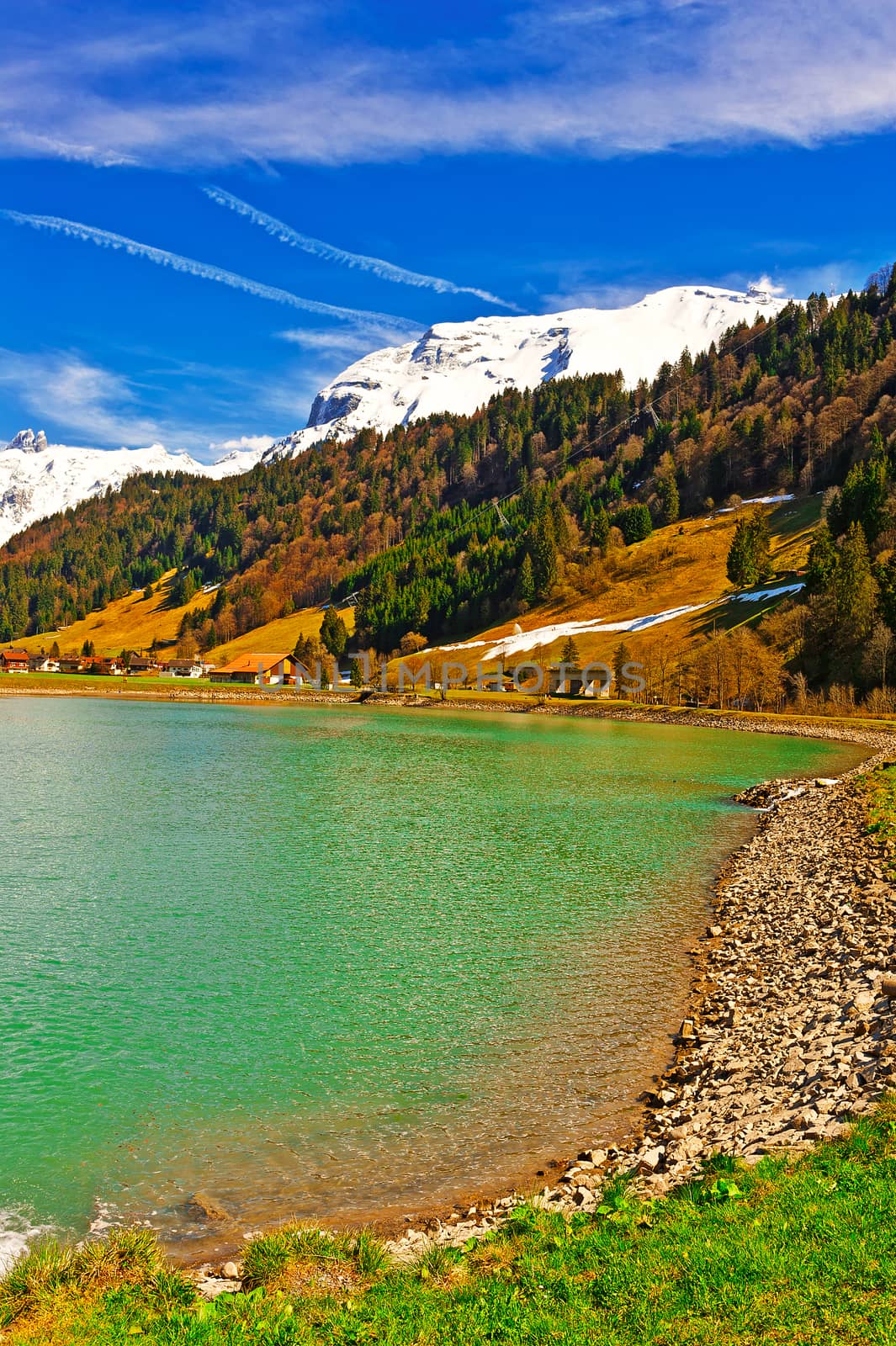 Mountain Lake on the Background of Snow-capped Alps in Switzerland
