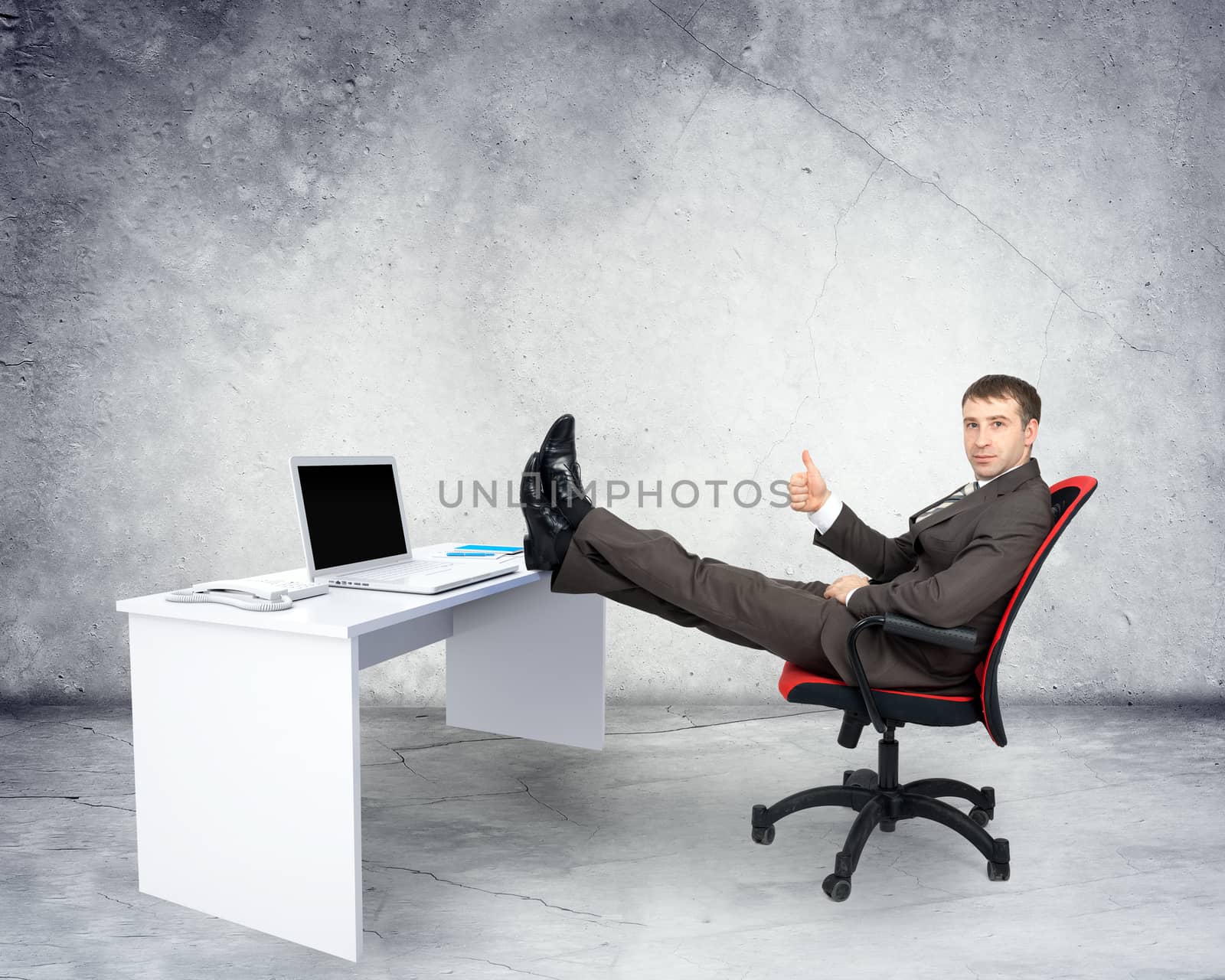 Businessman sitting on chair with table laptop by cherezoff