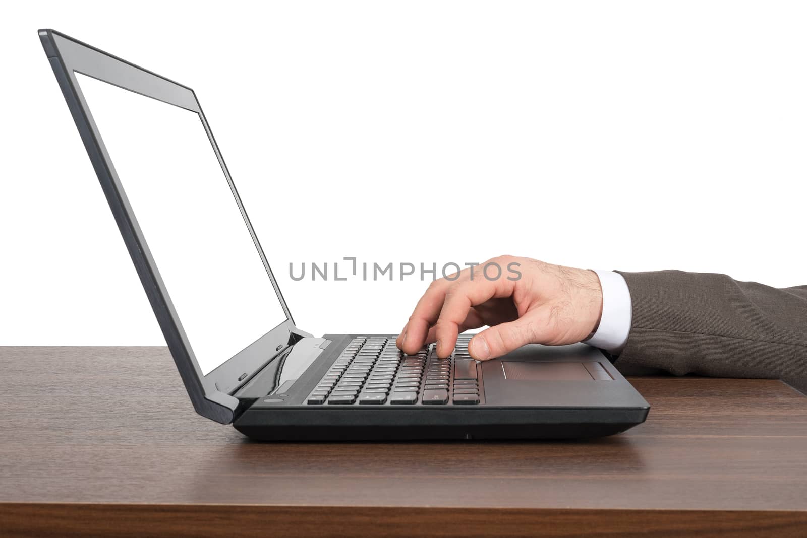 Businessmans hand working on laptop on table isolated on white background