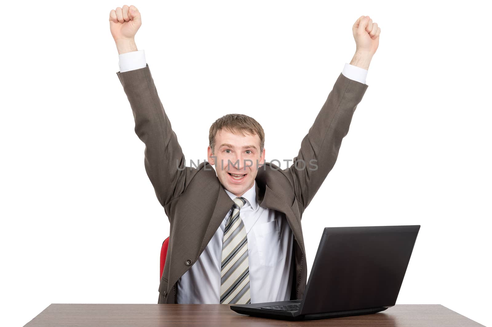 Happy businessman working on laptop and looking at camera isolated on white background