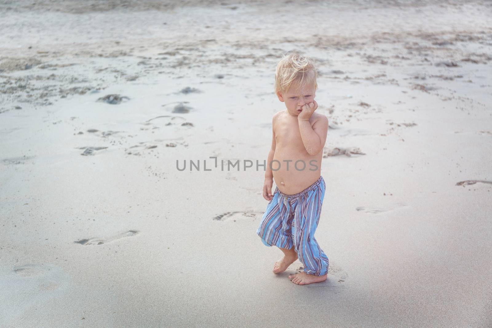 Toddler walking on a beach by gorov108