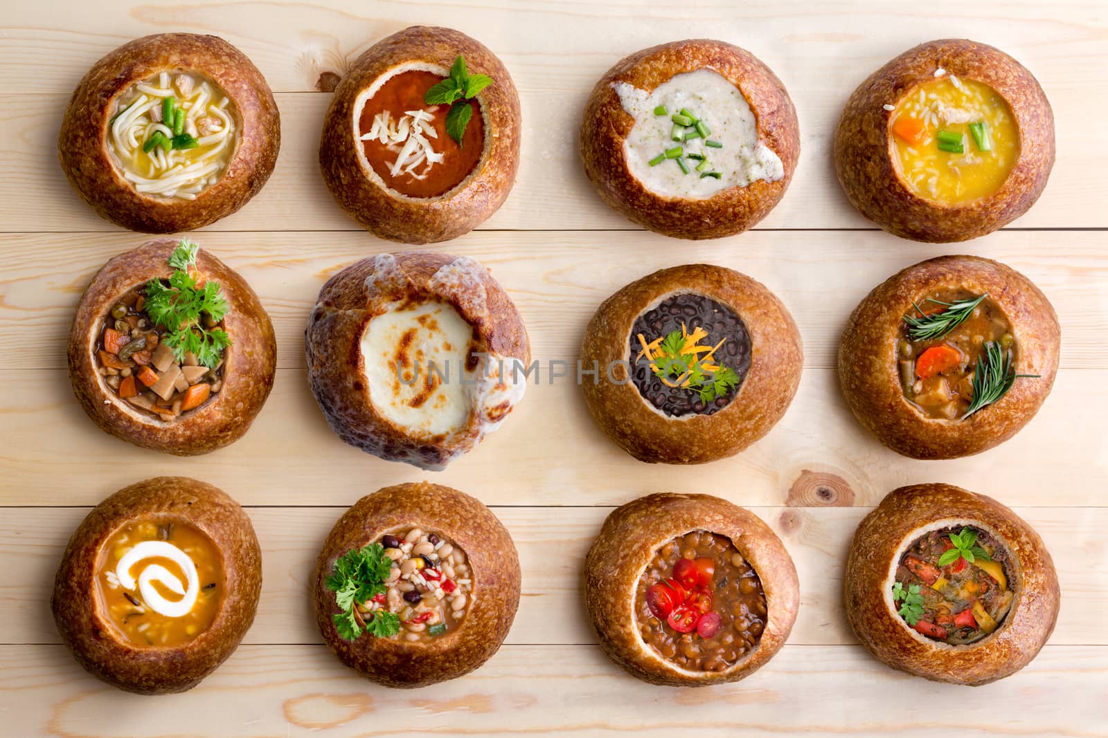 Twelve Soup Varieties Served in Bread Bowls by coskun