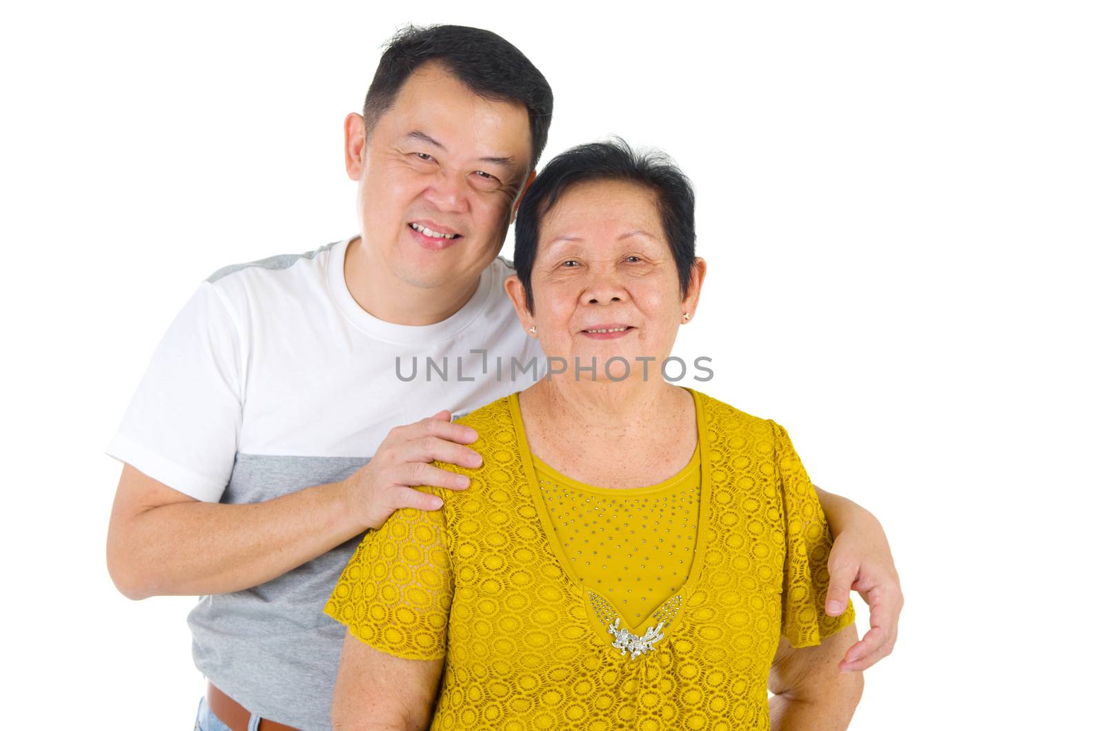 Senior woman and son. Happy Asian family senior mother and adult offspring having fun time at indoor studio.