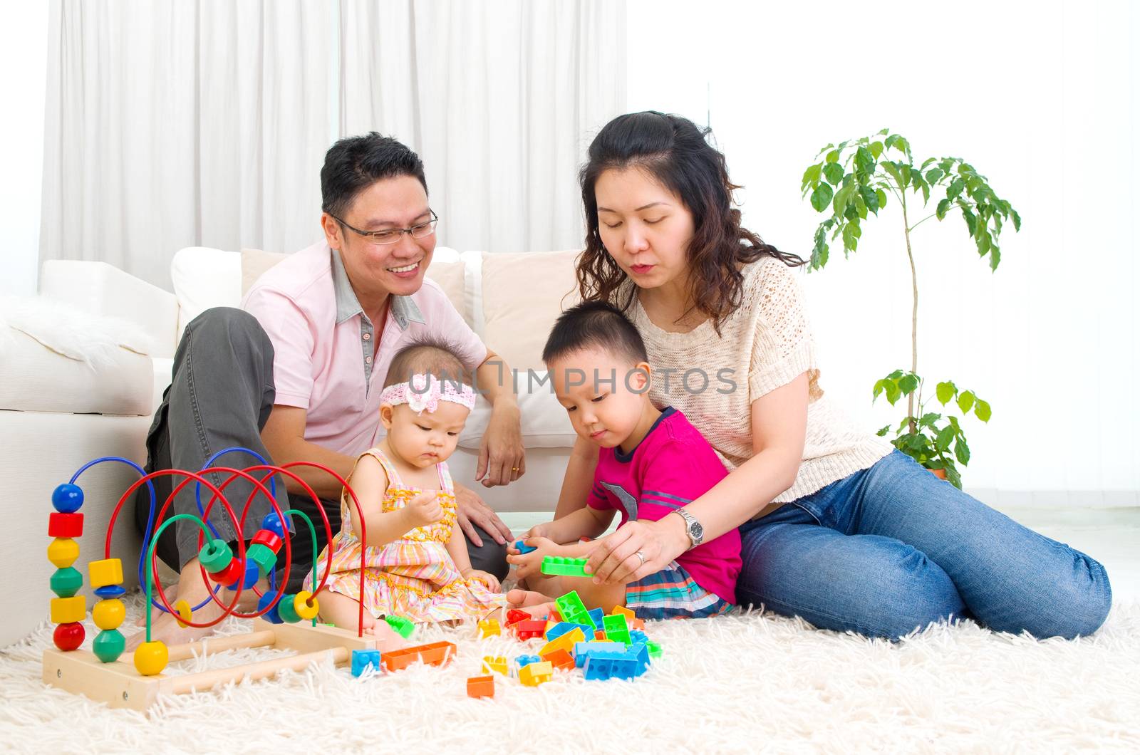 Asian family playing toys