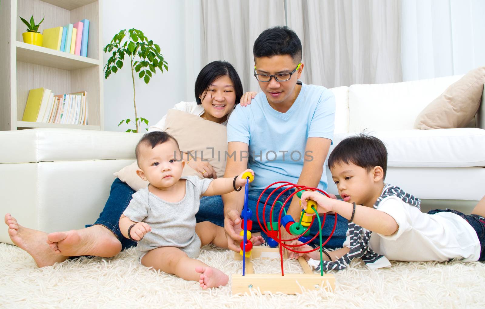 Asian family playing toys