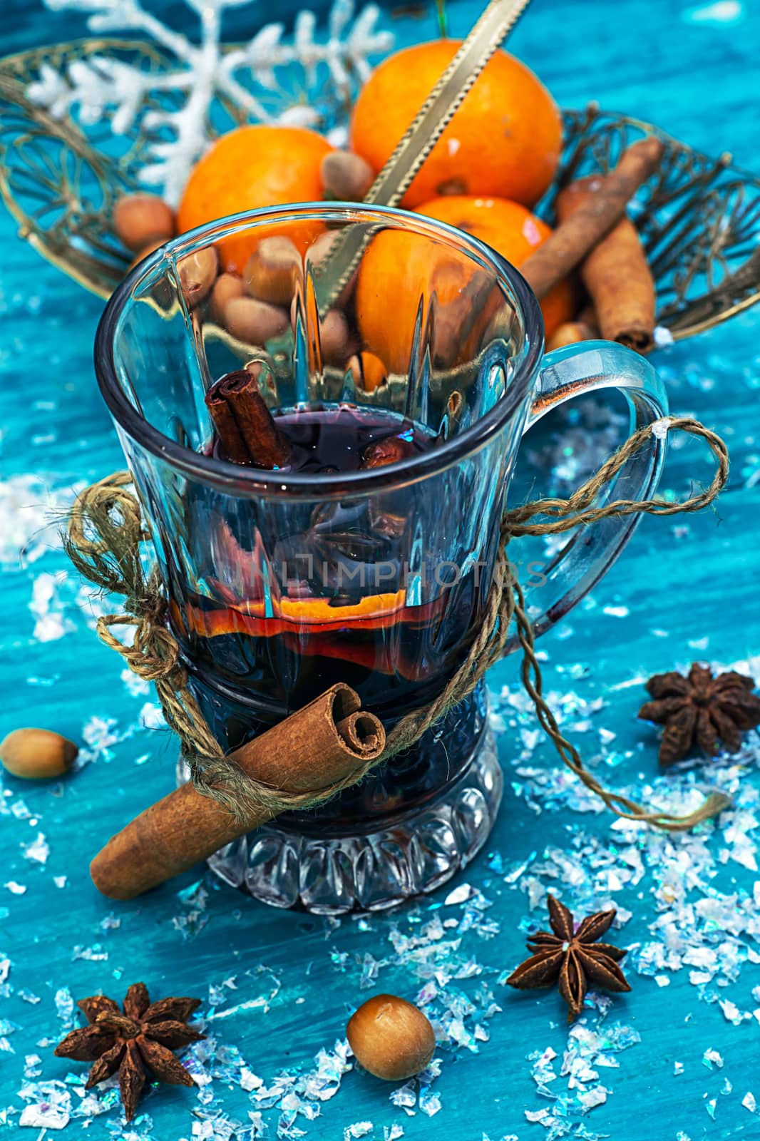warming drink mulled wine on bright blue background.Photo tinted